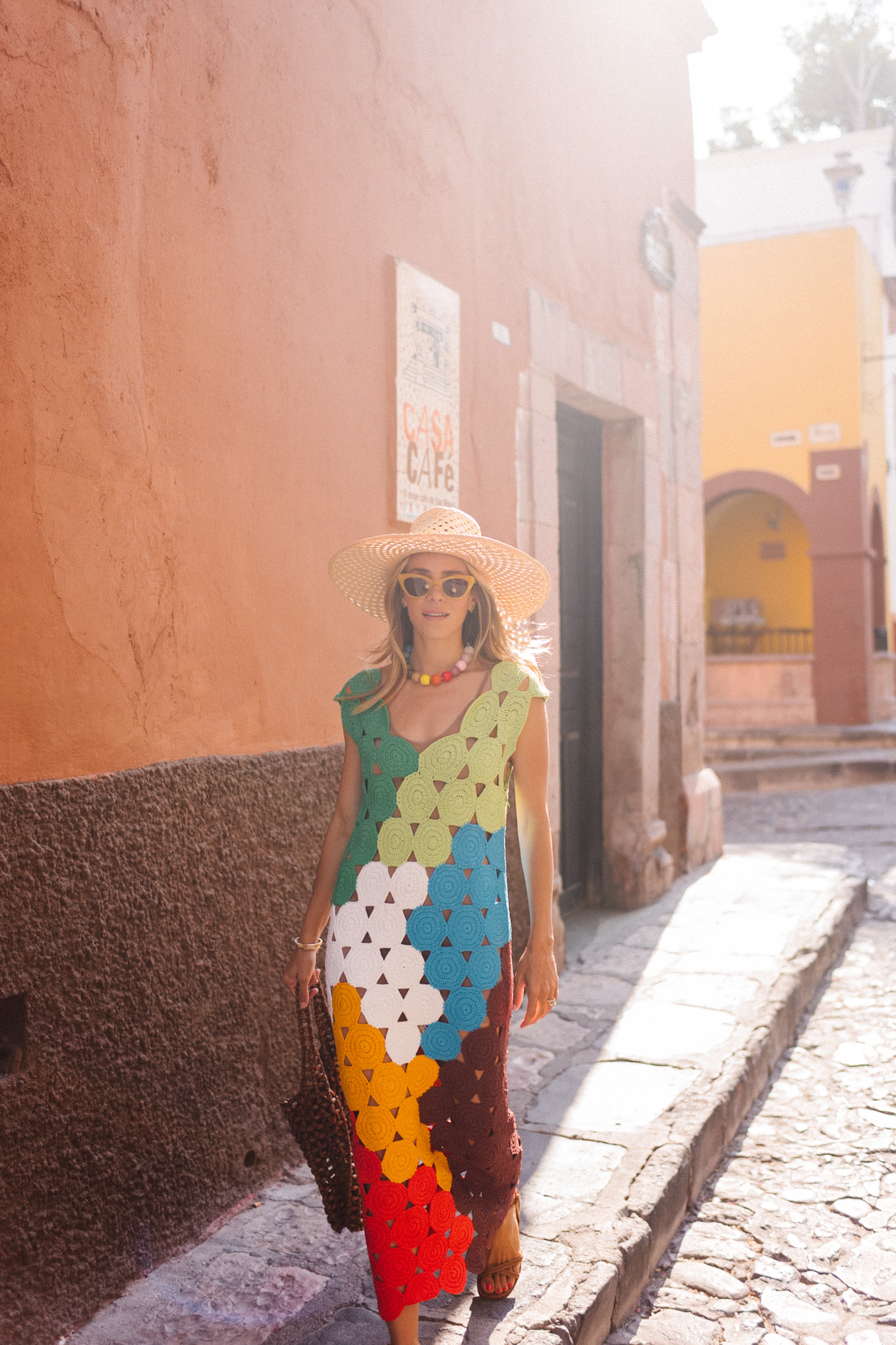 rainbow crochet midi dress brown strappy sandals woven bag straw hat summer accessories