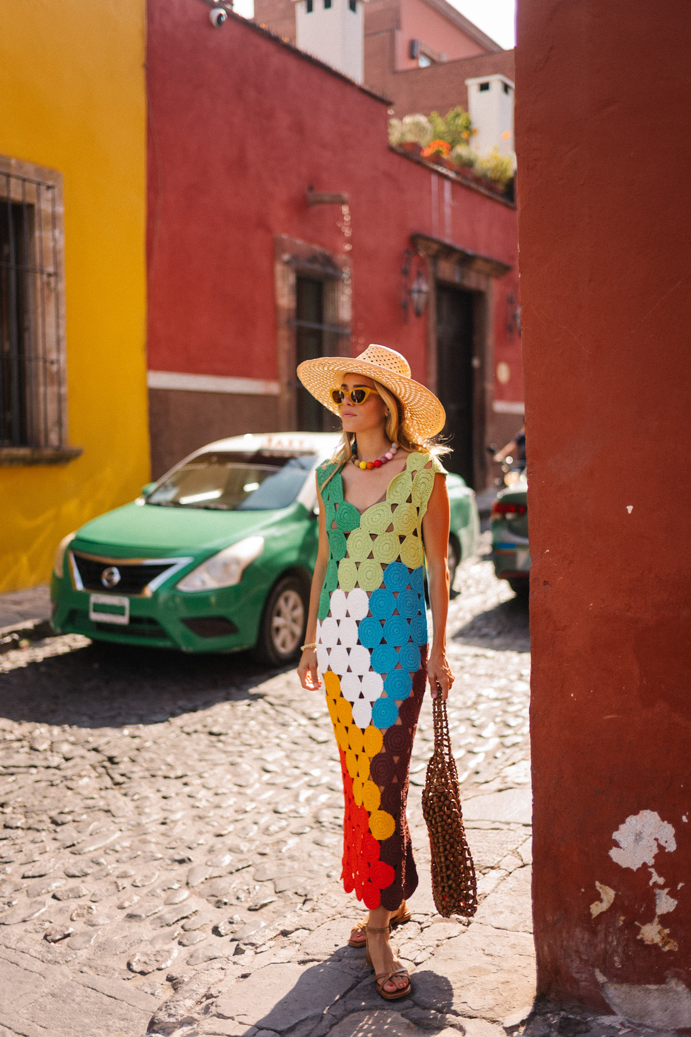 rainbow crochet midi dress brown strappy sandals woven bag straw hat summer accessories