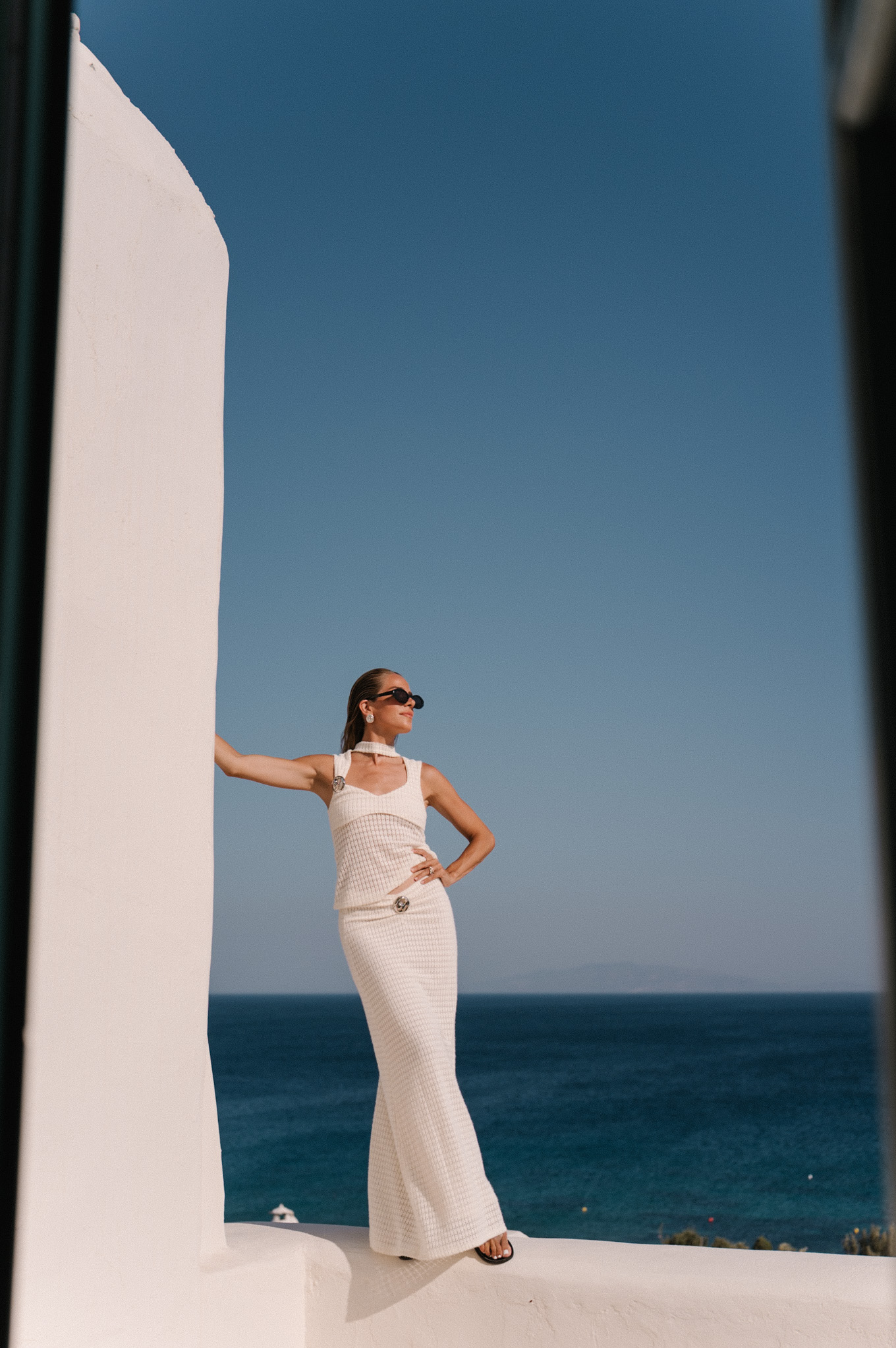 cream crochet halter tank with matching maxi skirt black sunglasses