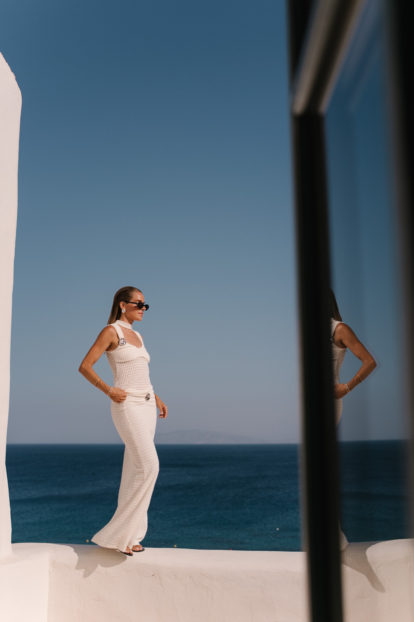 cream crochet halter tank with matching maxi skirt black sunglasses