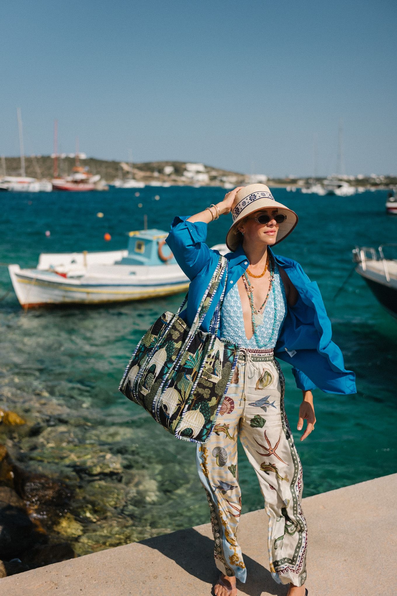 blue one piece swim seashell silk beach pants blue oxford shirt coastal necklaces