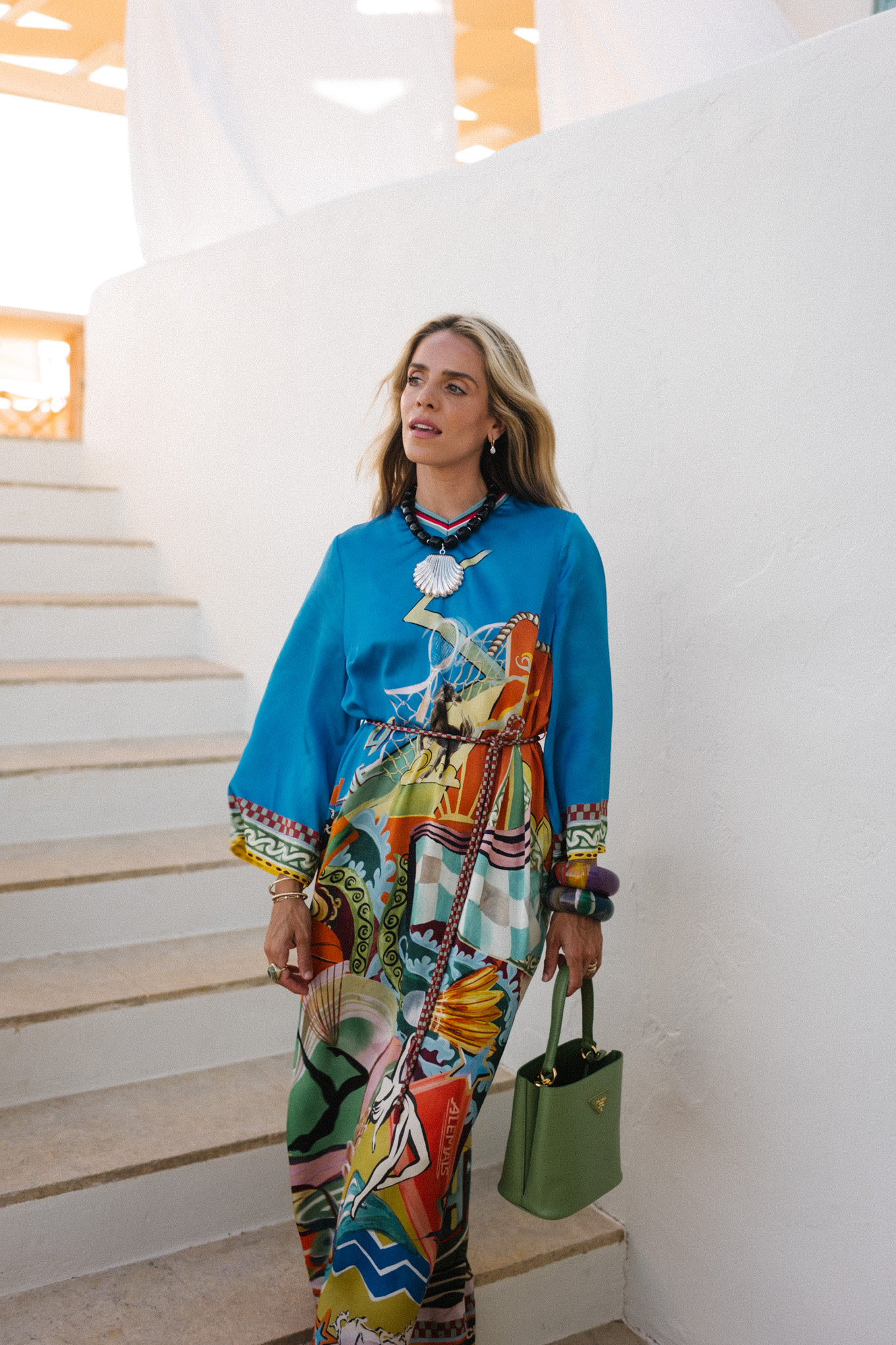 blue silk kaftan black beaded seashell necklace black strappy sandals