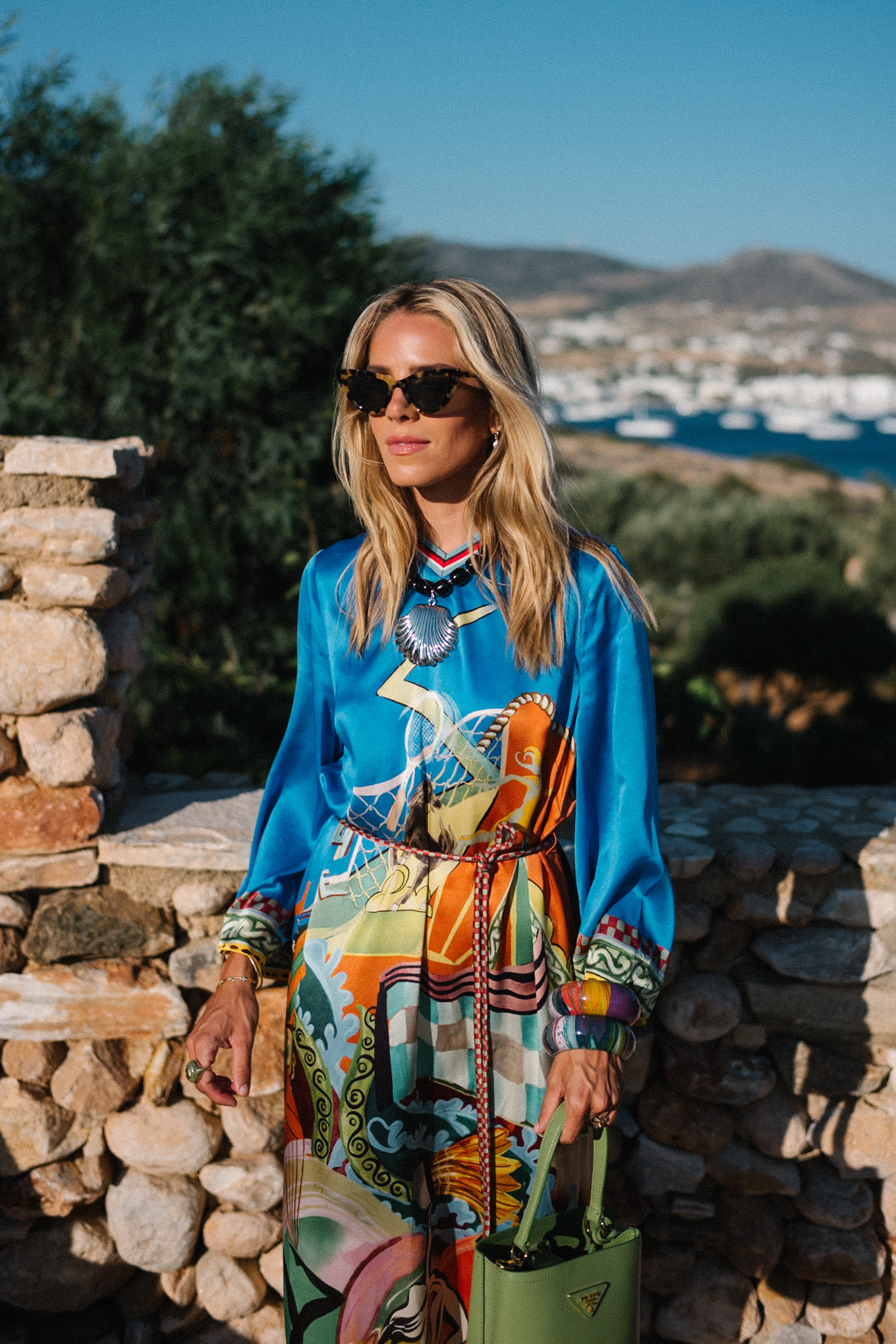 blue silk kaftan black beaded seashell necklace black strappy sandals