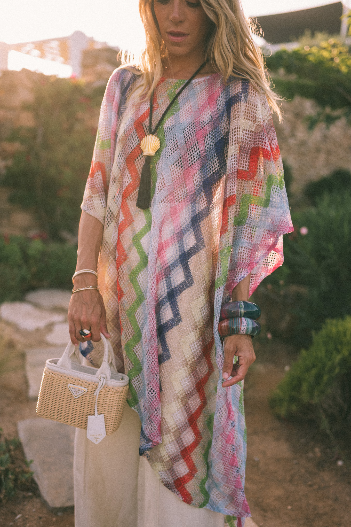 sheer rainbow crochet tunic cream silky pants basket bag black seashell necklace