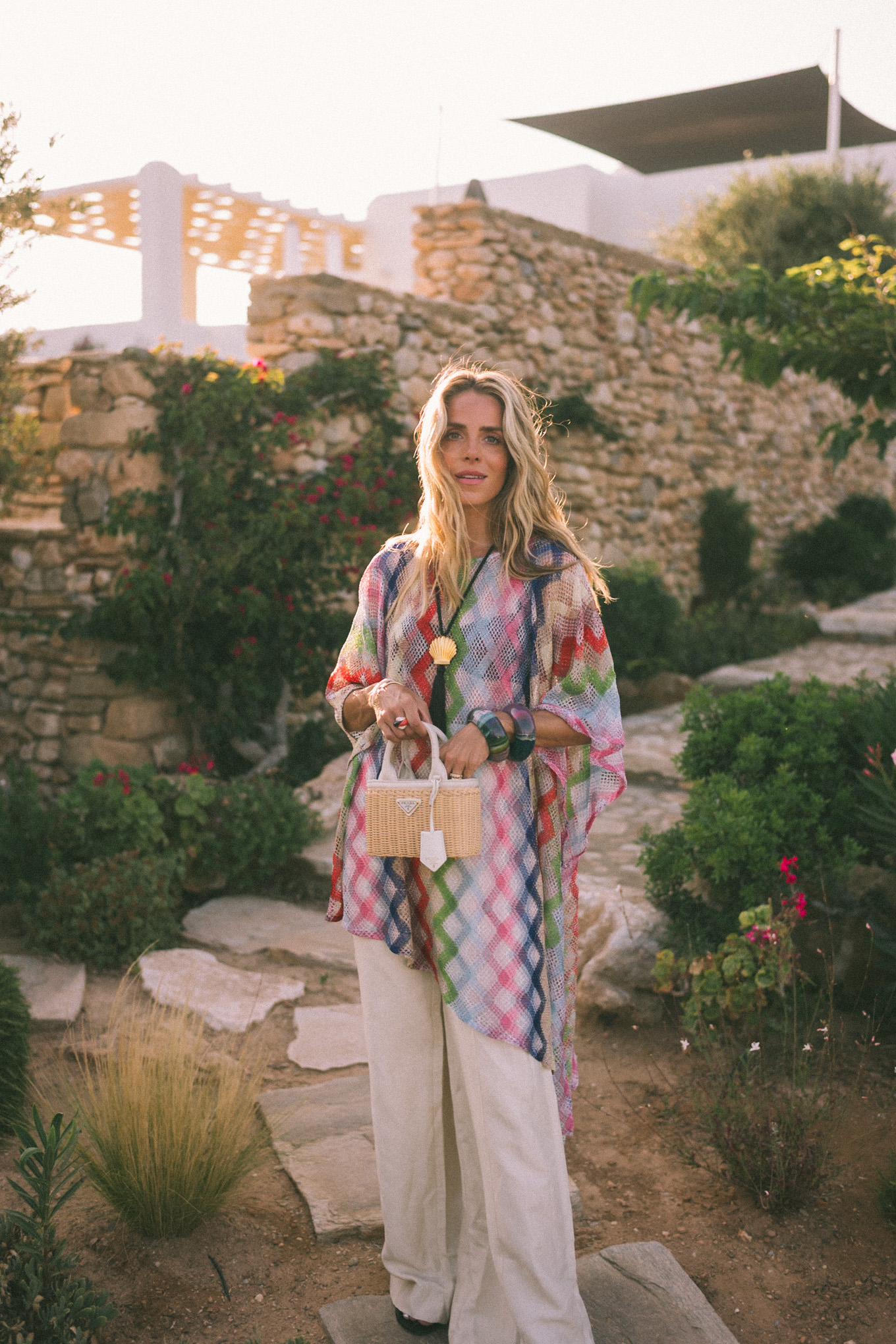 sheer rainbow crochet tunic cream silky pants basket bag black seashell necklace