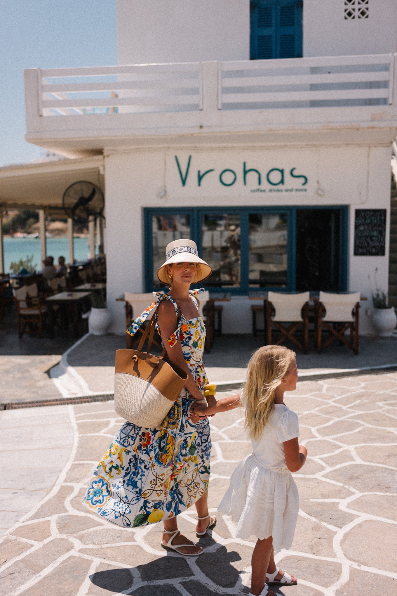 mosaic sundress raffia bucket hat raffia and leather tote white sandals