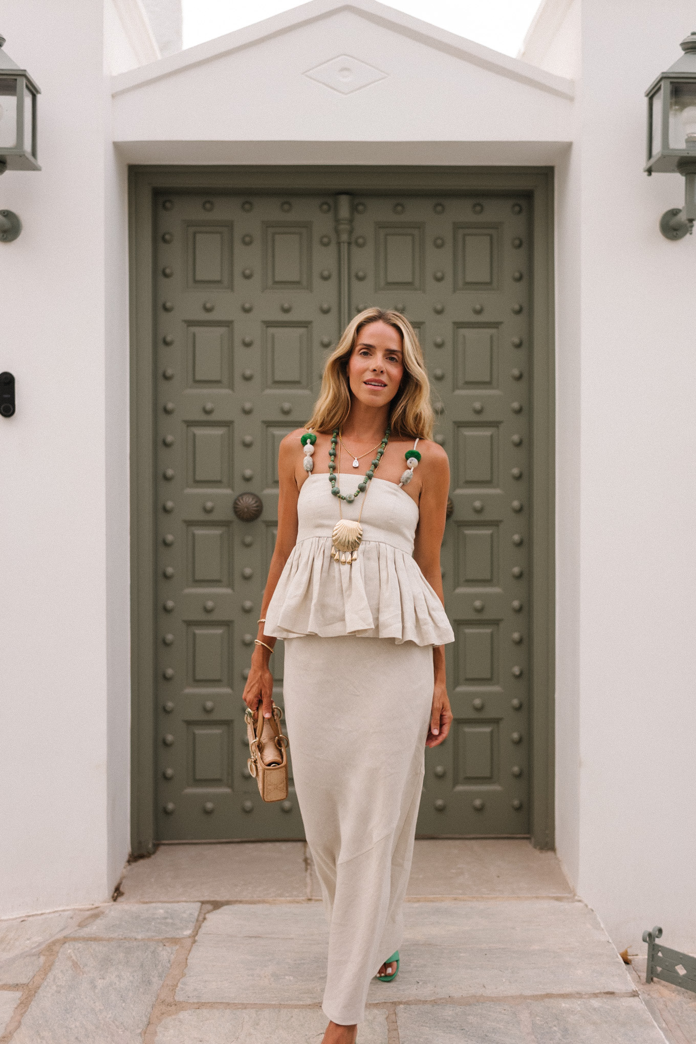 tan linen skirt set green beaded necklace green sandals raffia bag