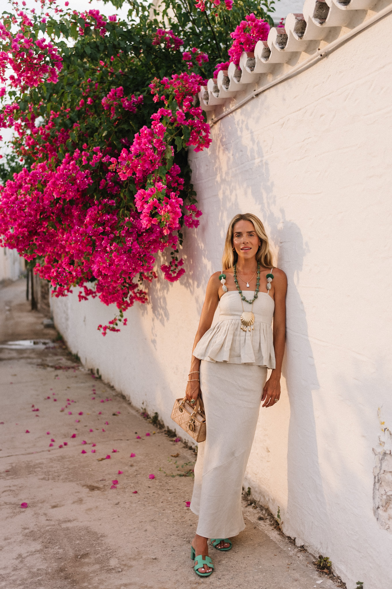 tan linen skirt set green beaded necklace green sandals raffia bag