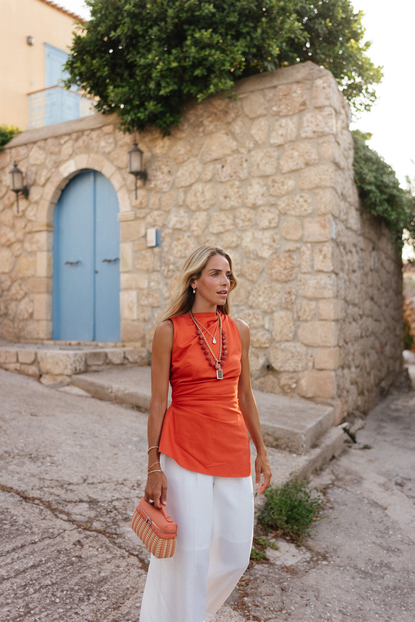 orange linen top white linen pants raffia heels orange basket bag layered necklaces