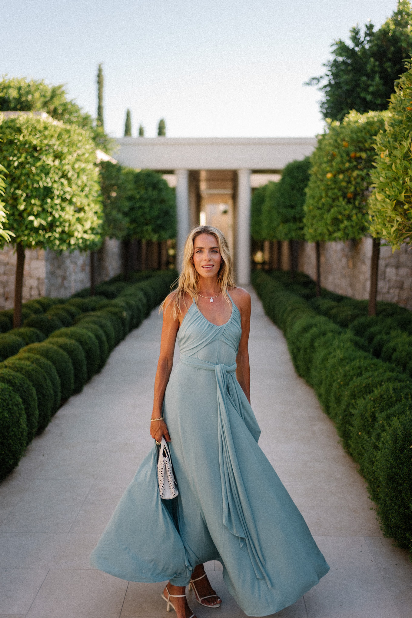 turquoise halter jersey maxi dress white leather cut out bag white leather heeled sandals