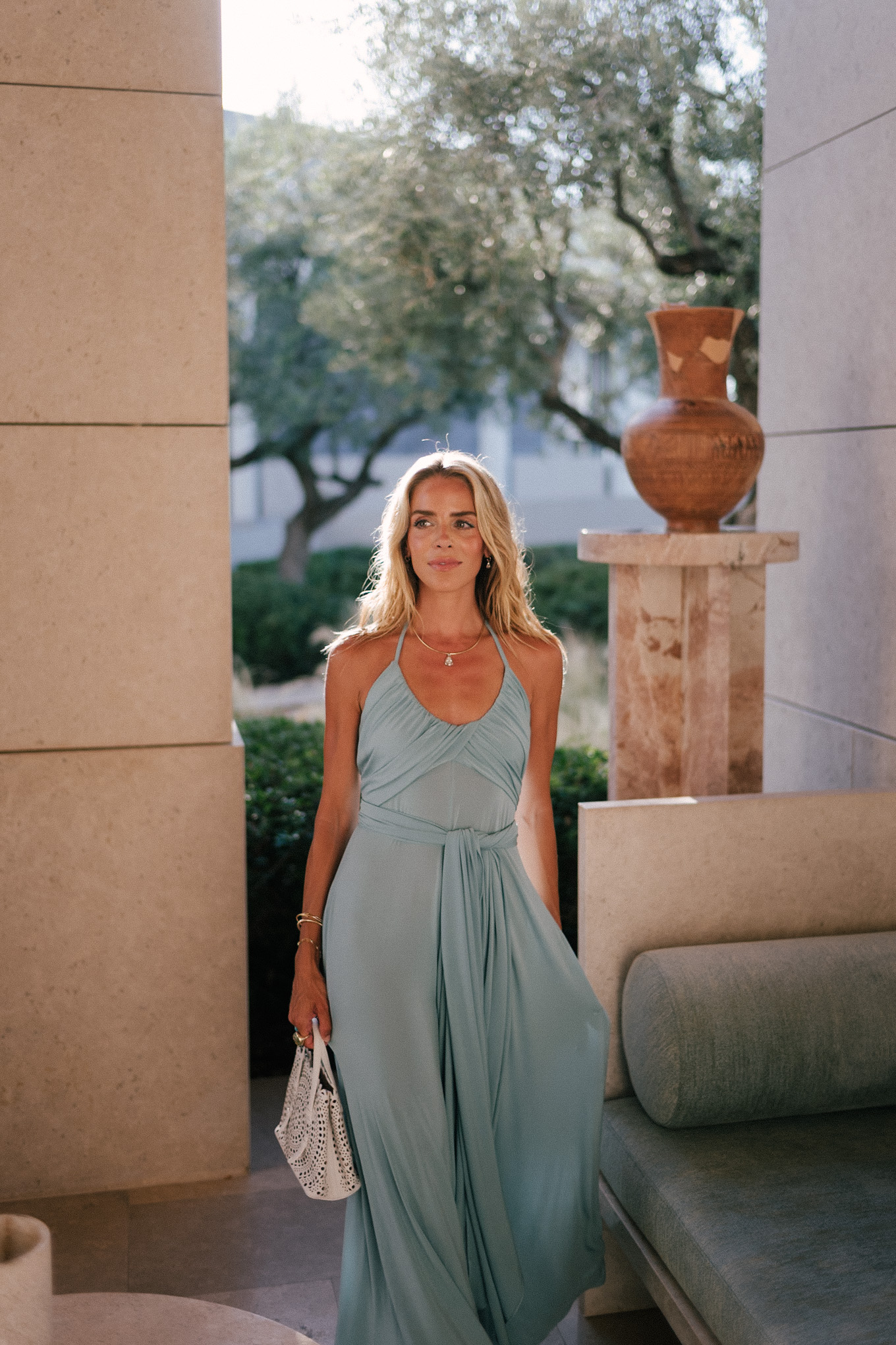 turquoise halter jersey maxi dress white leather cut out bag white leather heeled sandals