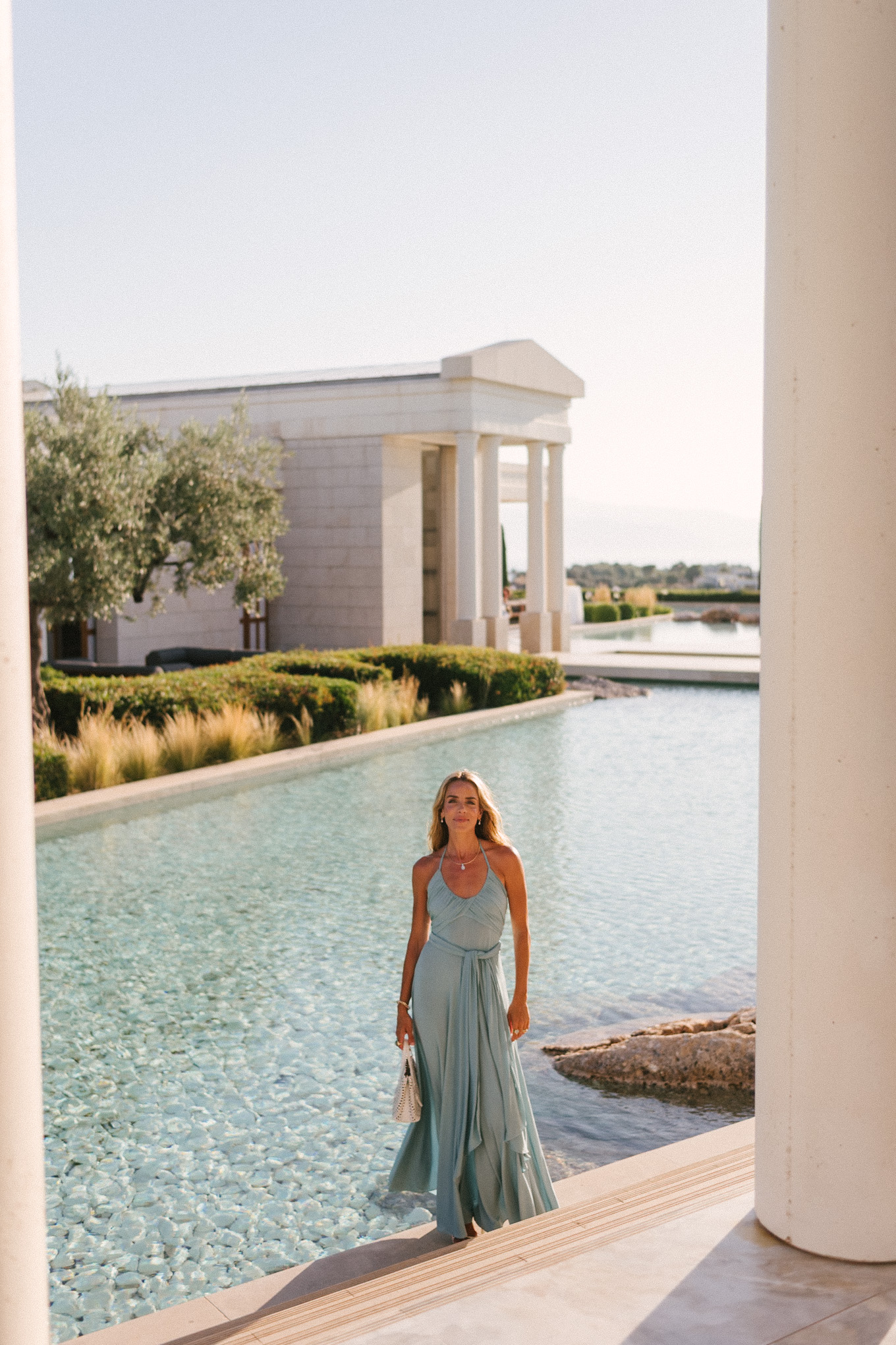 turquoise halter jersey maxi dress white leather cut out bag white leather heeled sandals