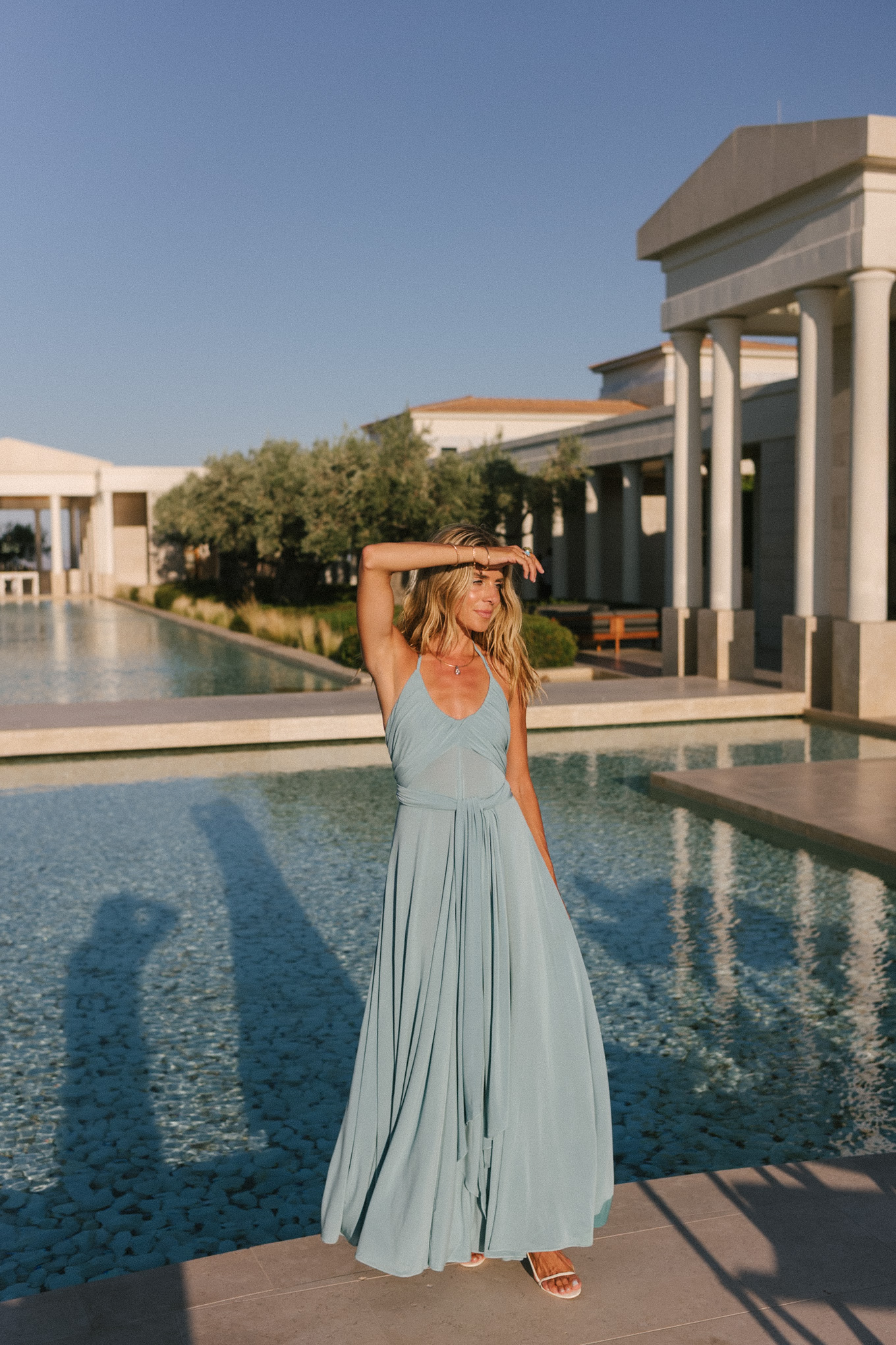 turquoise halter jersey maxi dress white leather cut out bag white leather heeled sandals