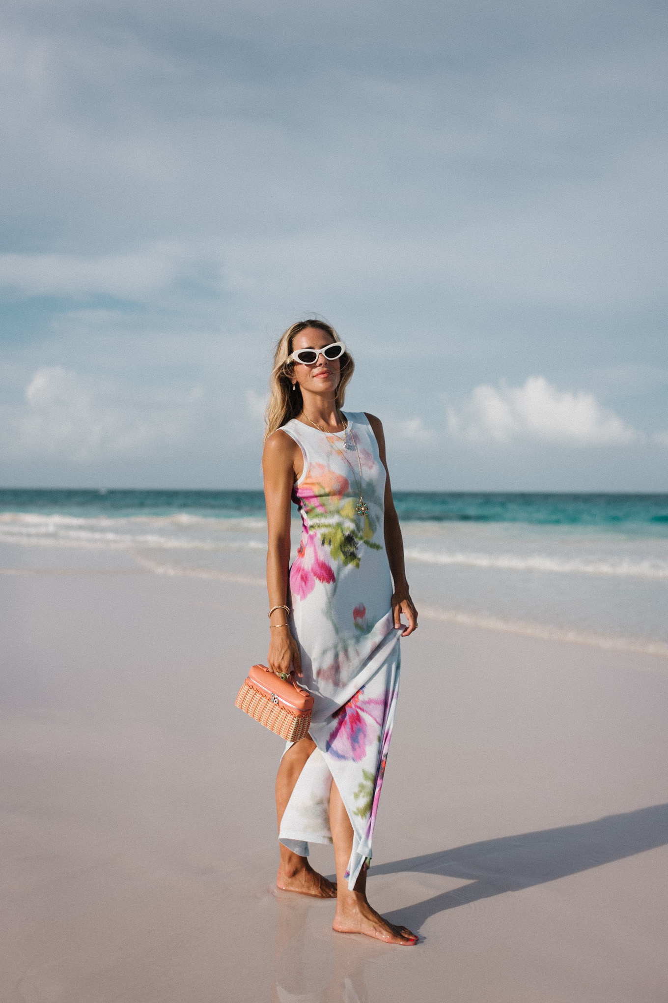 white floral jersey midi dress orange raffia handbag white sunglasses