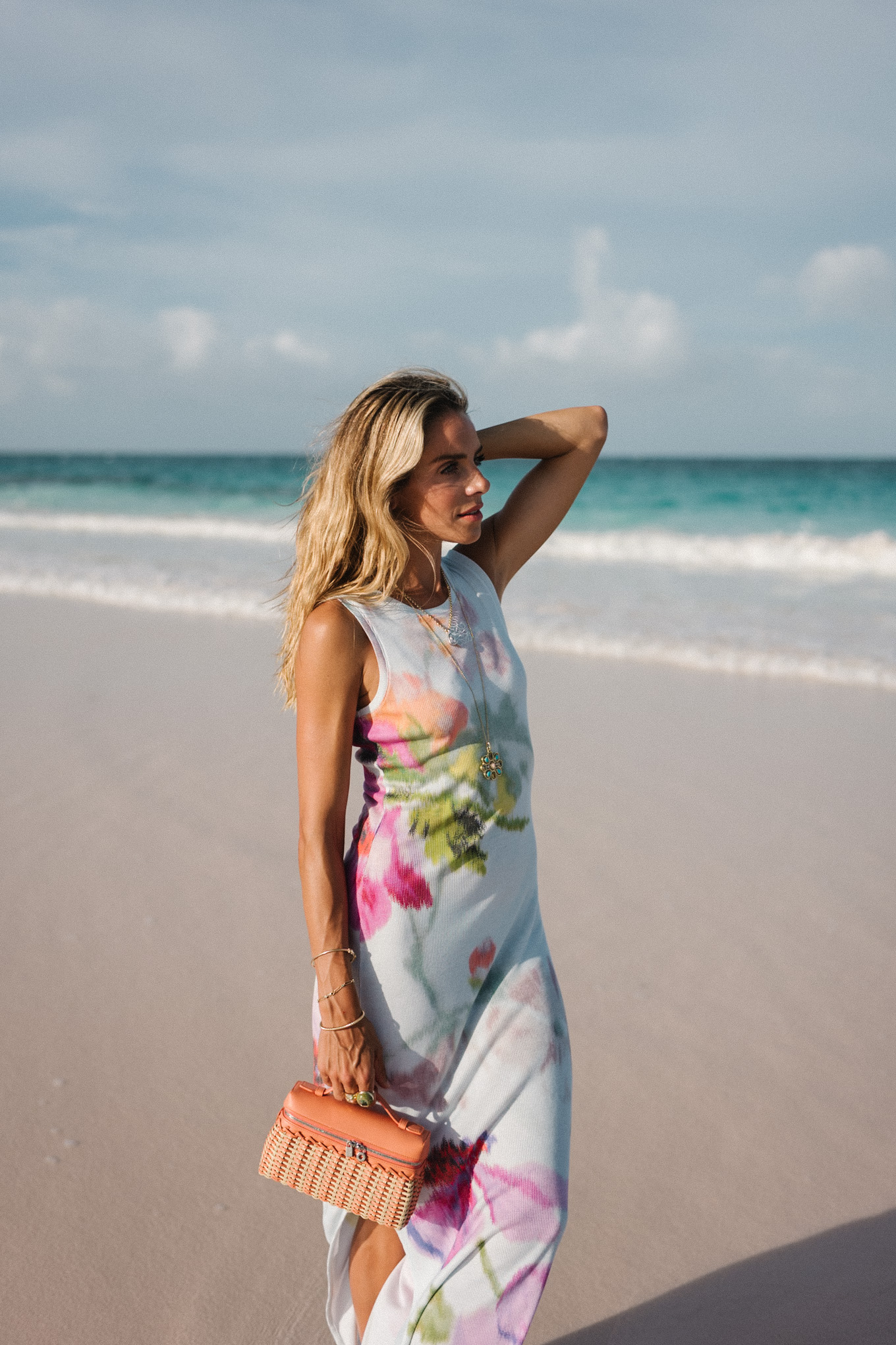 white floral jersey midi dress orange raffia handbag