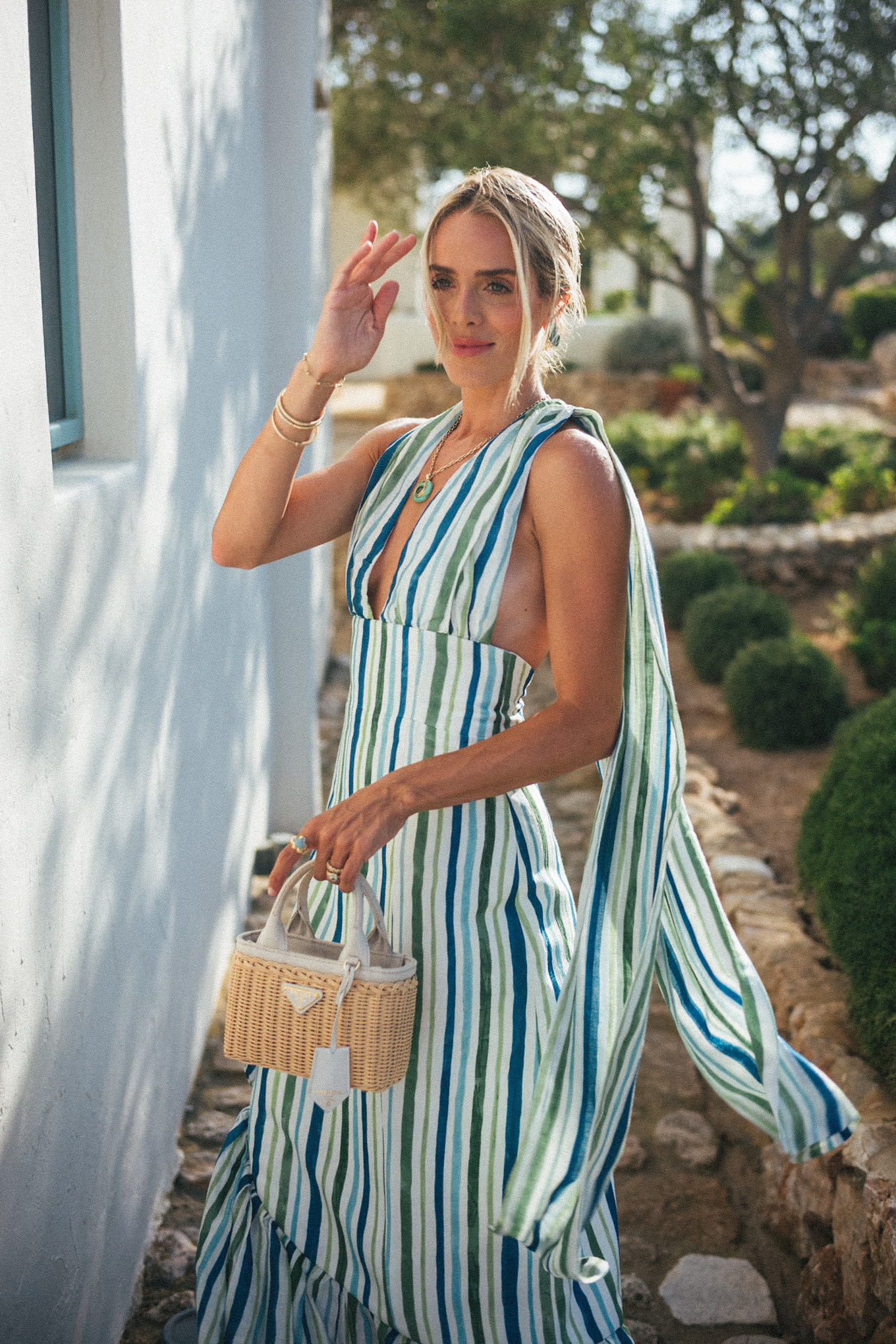 blue green white striped linen dress turquoise jewelry white leather sandals rattan bag