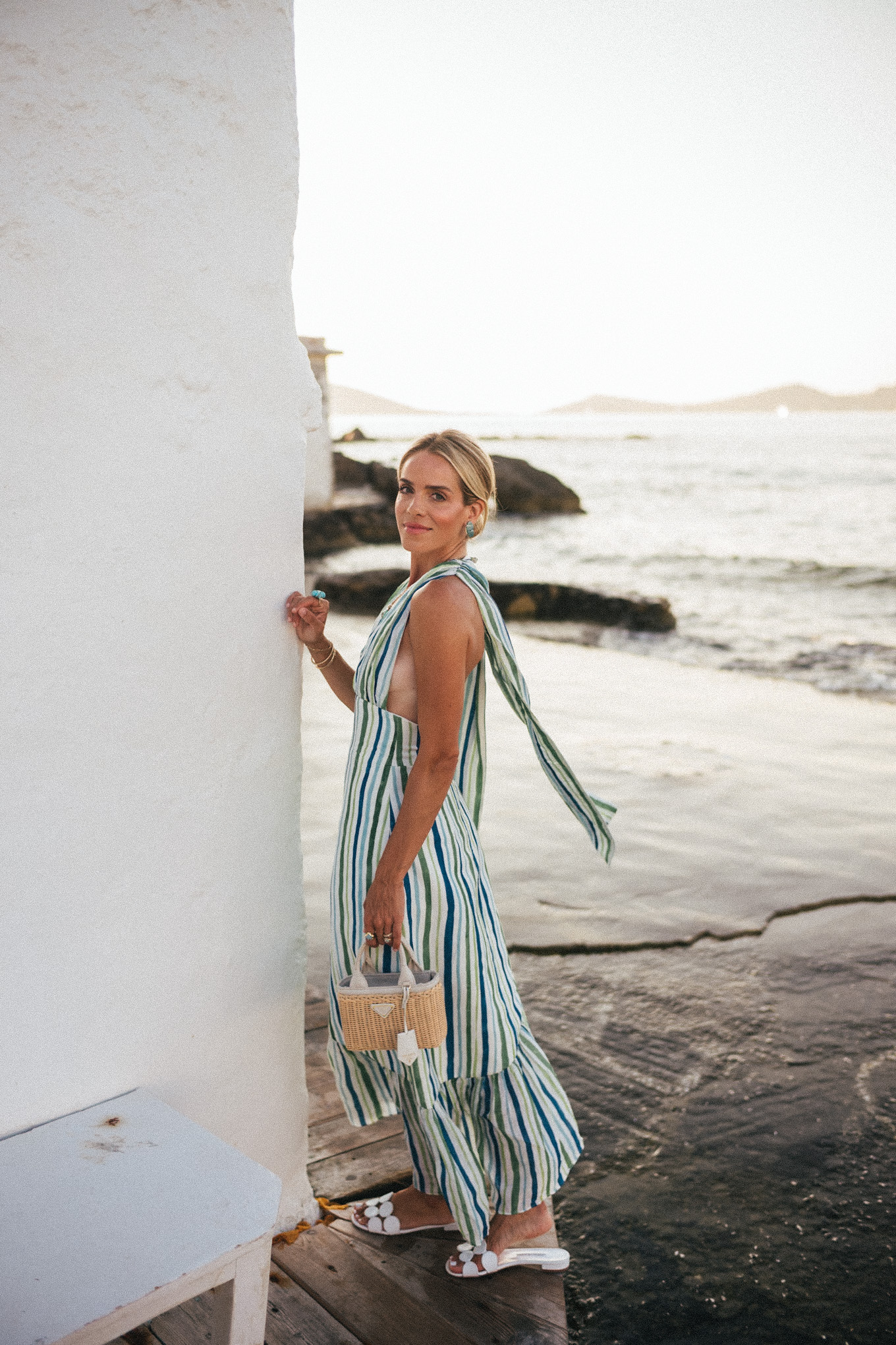 blue green white striped linen dress turquoise jewelry white leather sandals rattan bag