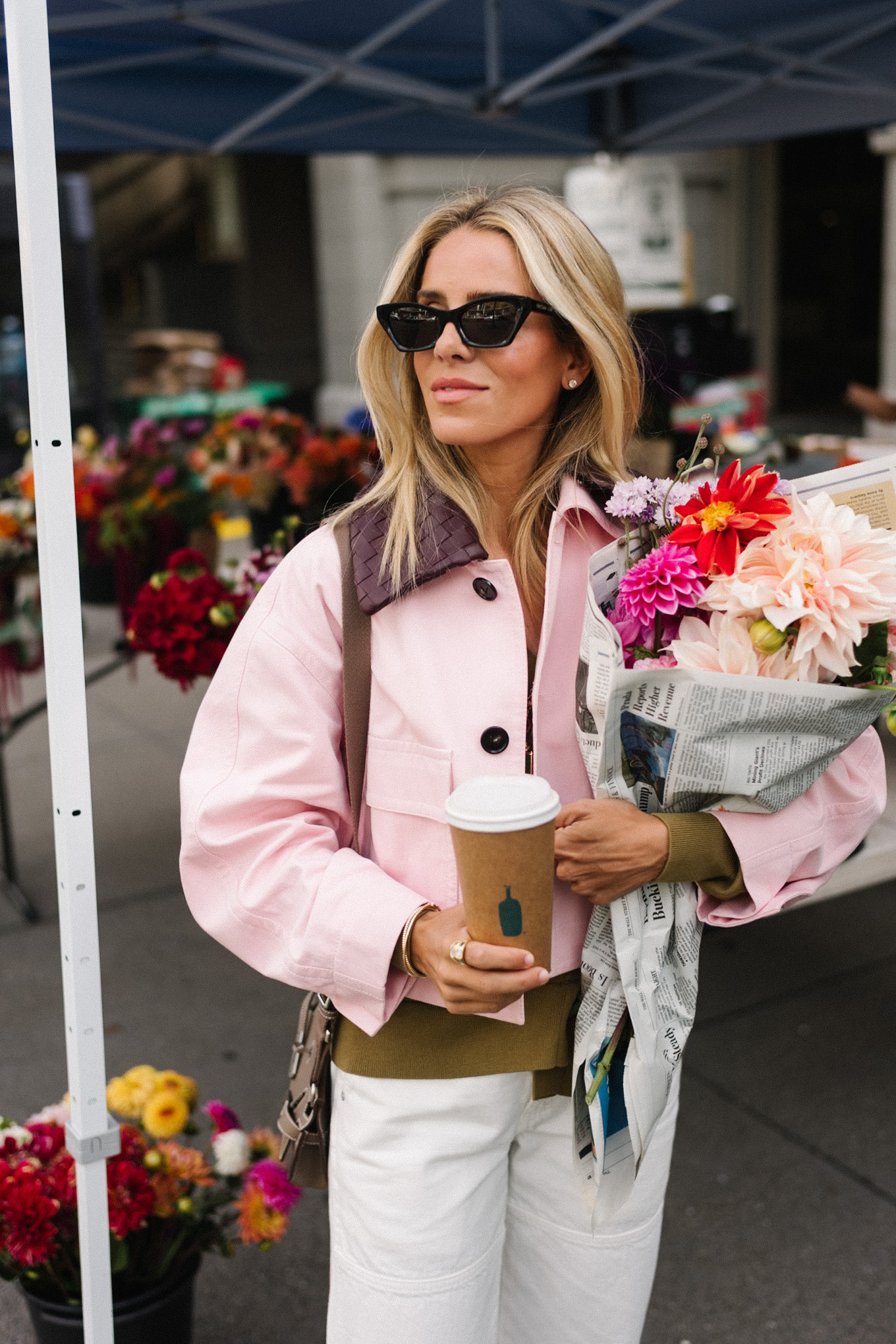 pink cropped barn jacket white denim green sweater green sneakers