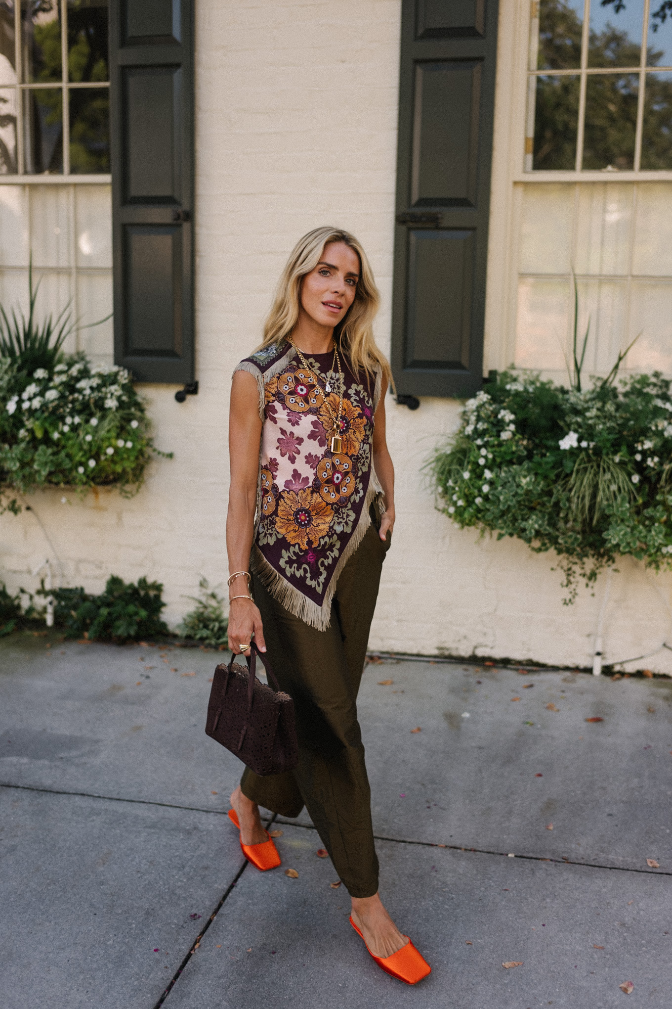 purple floral scarf top brown satin pants brown handbag orange mules
