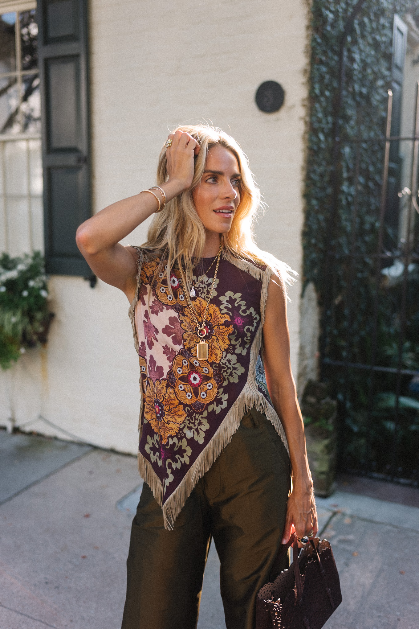 purple floral scarf top brown satin pants brown handbag orange mules