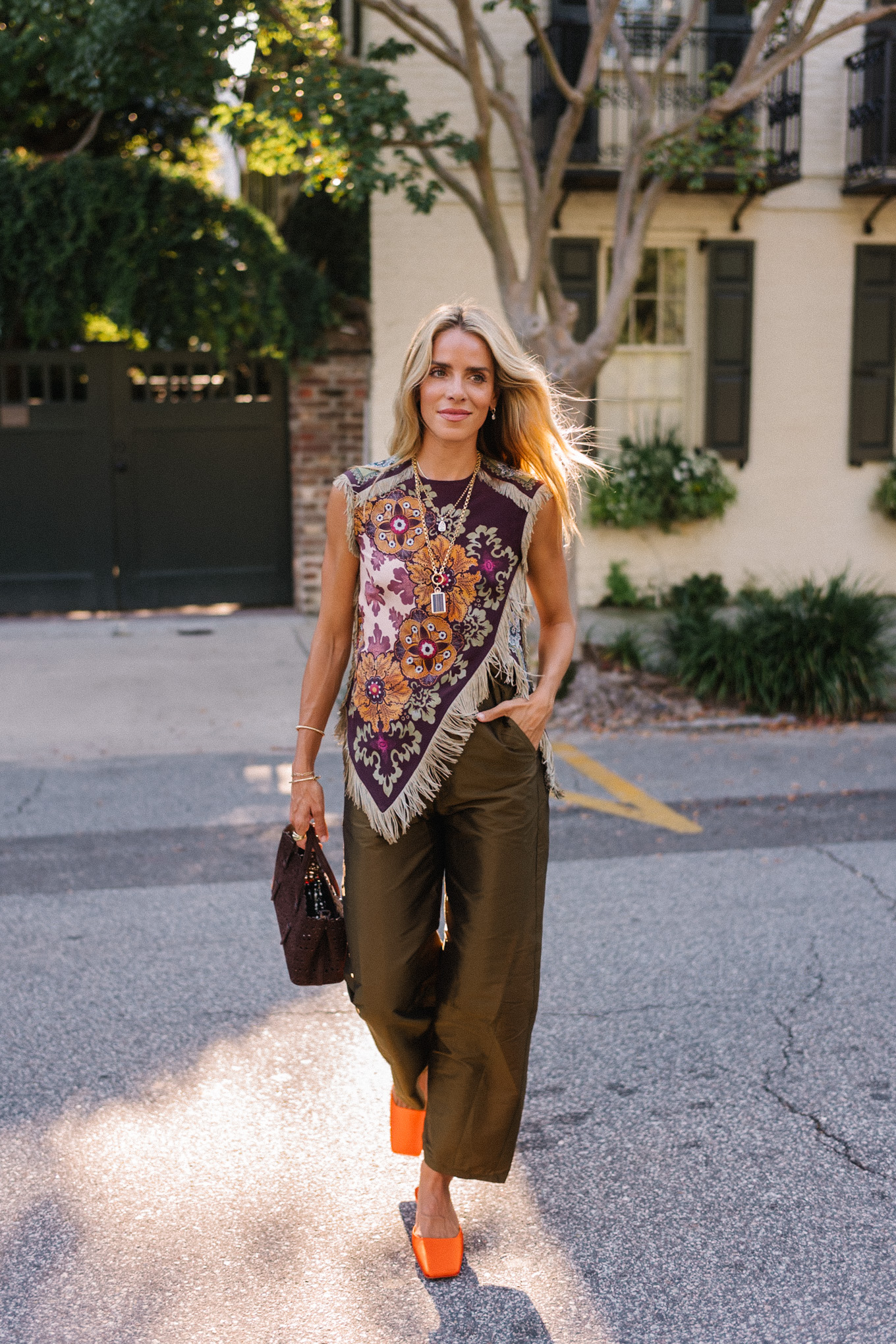 purple floral scarf top brown satin pants brown handbag orange mules