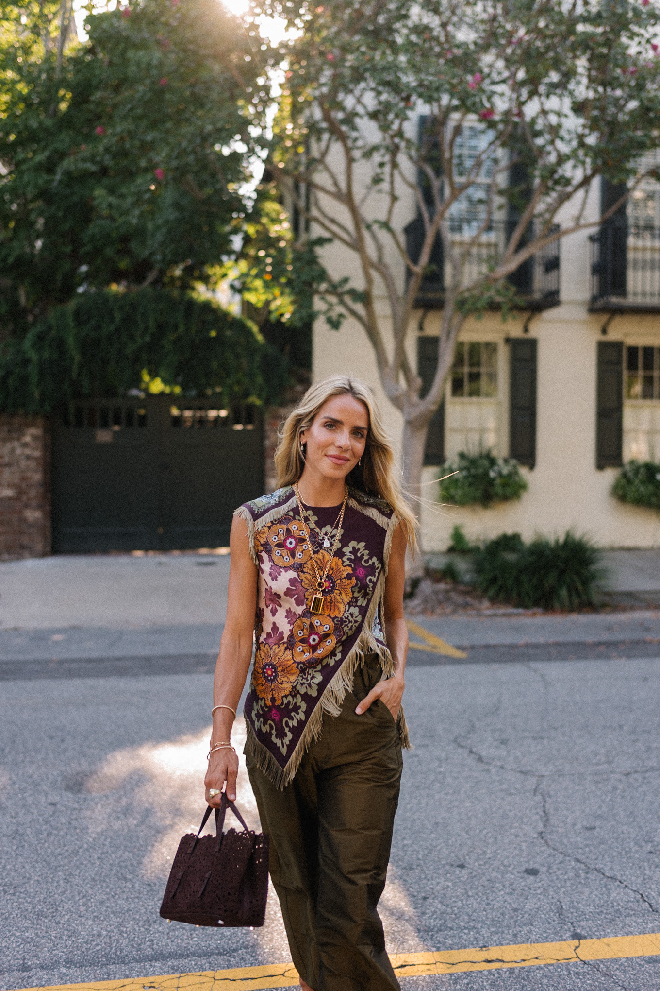 purple floral scarf top brown satin pants brown handbag orange mules