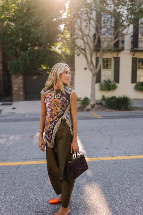 purple floral scarf top brown satin pants brown handbag orange mules