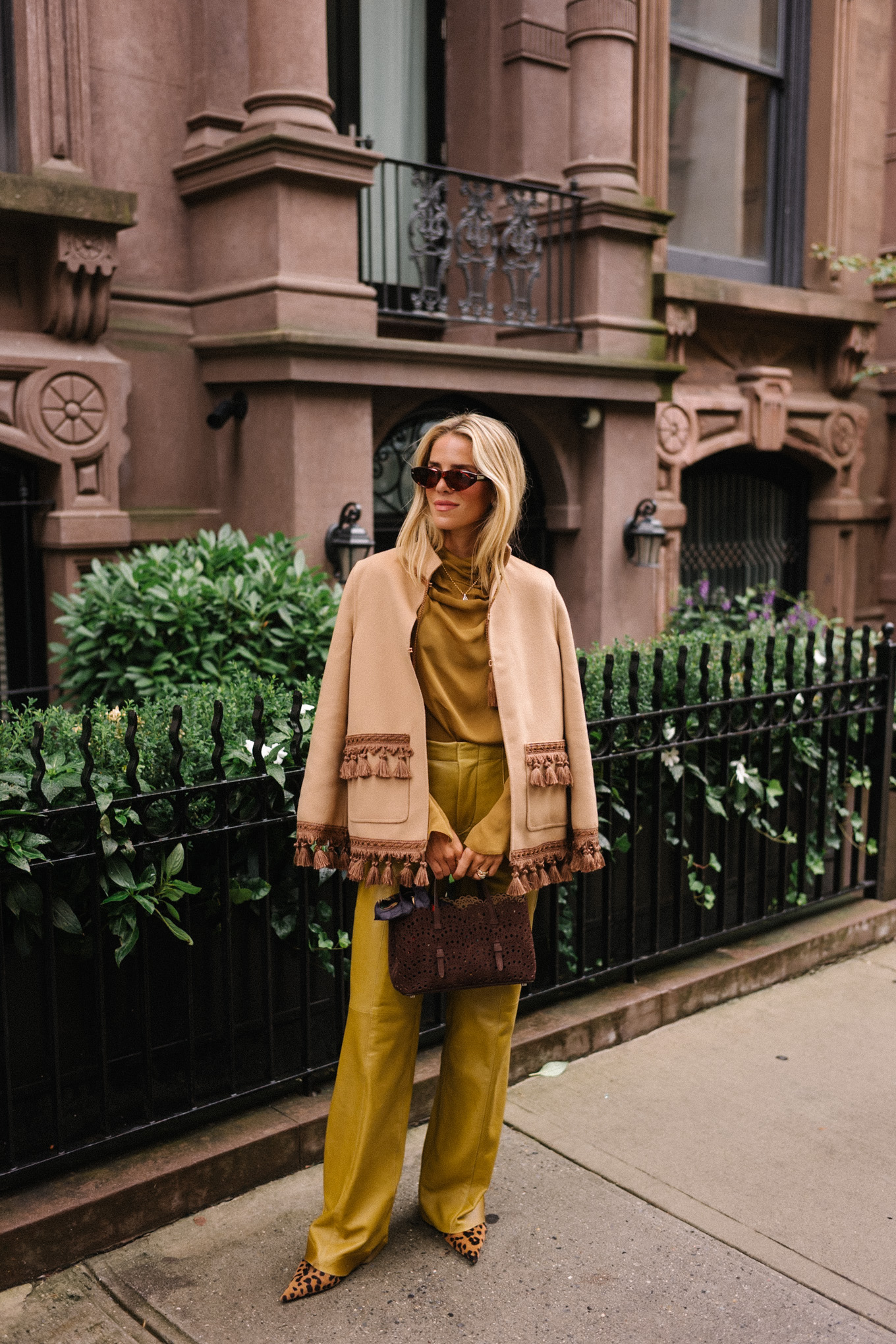 gold silk blouse gold leather pants tan suede coat