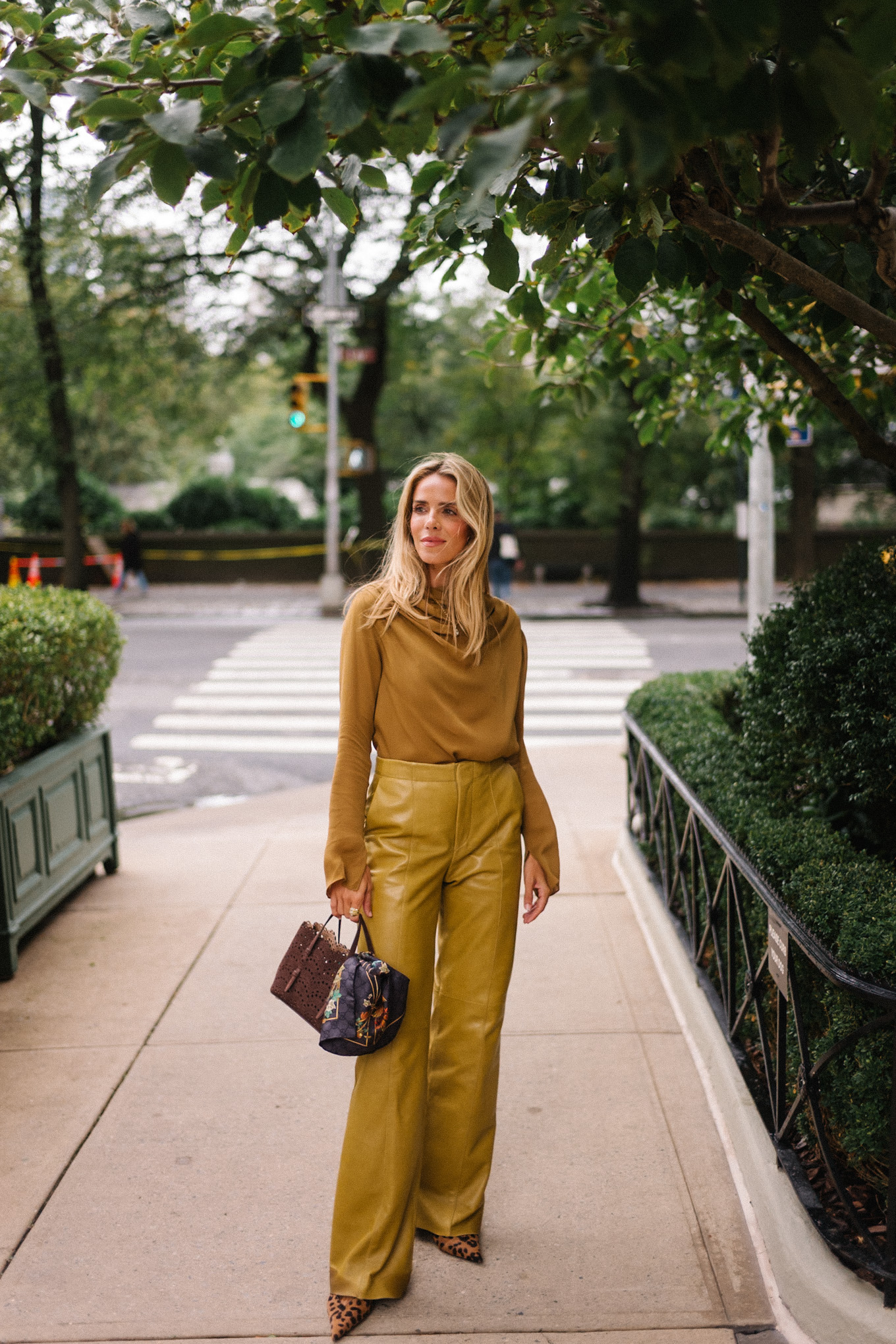 gold silk blouse gold leather pants tan suede coat