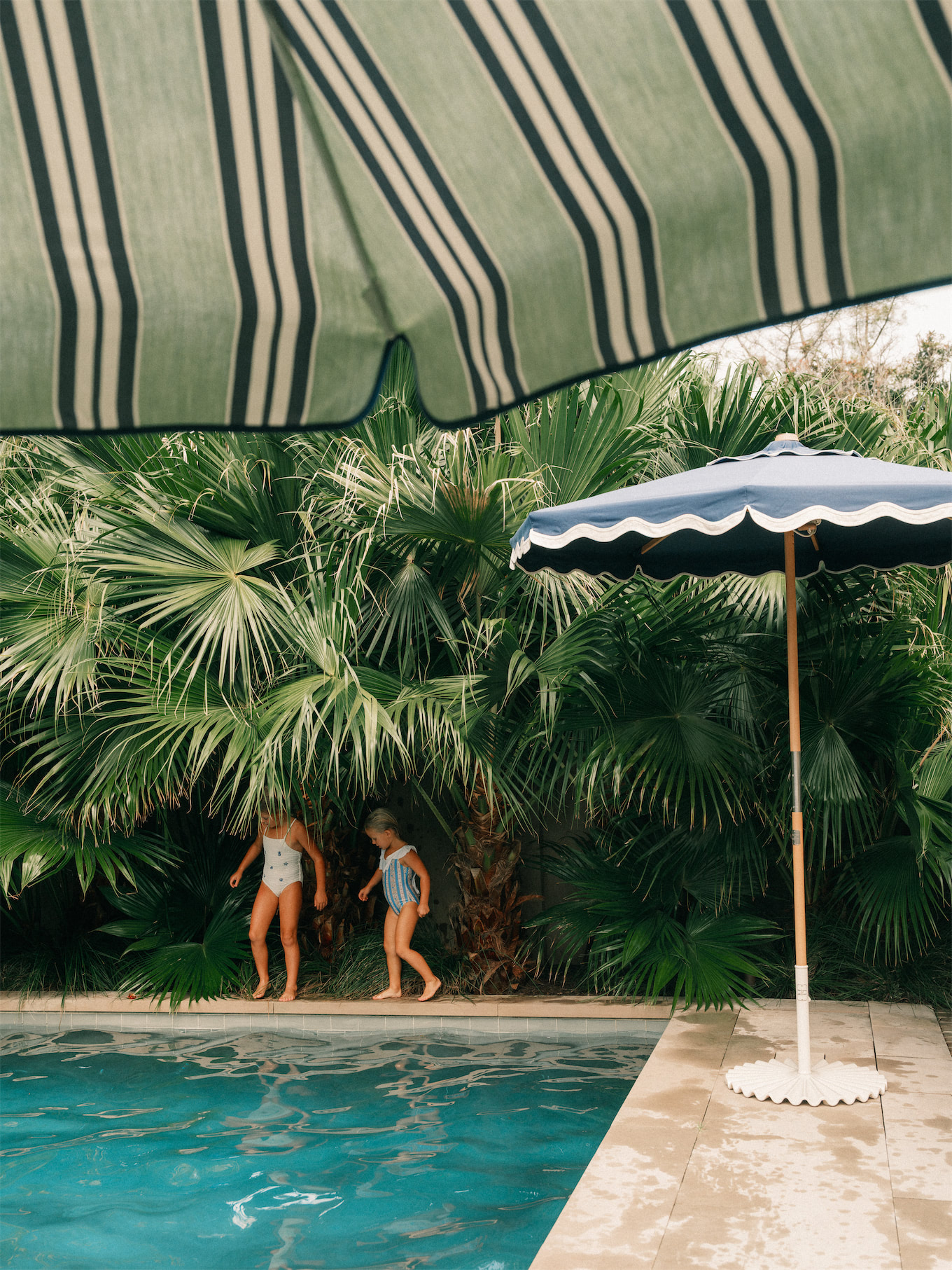 business and pleasure co blue green stripe pool towels outdoor cushions sun umbrellas coolers