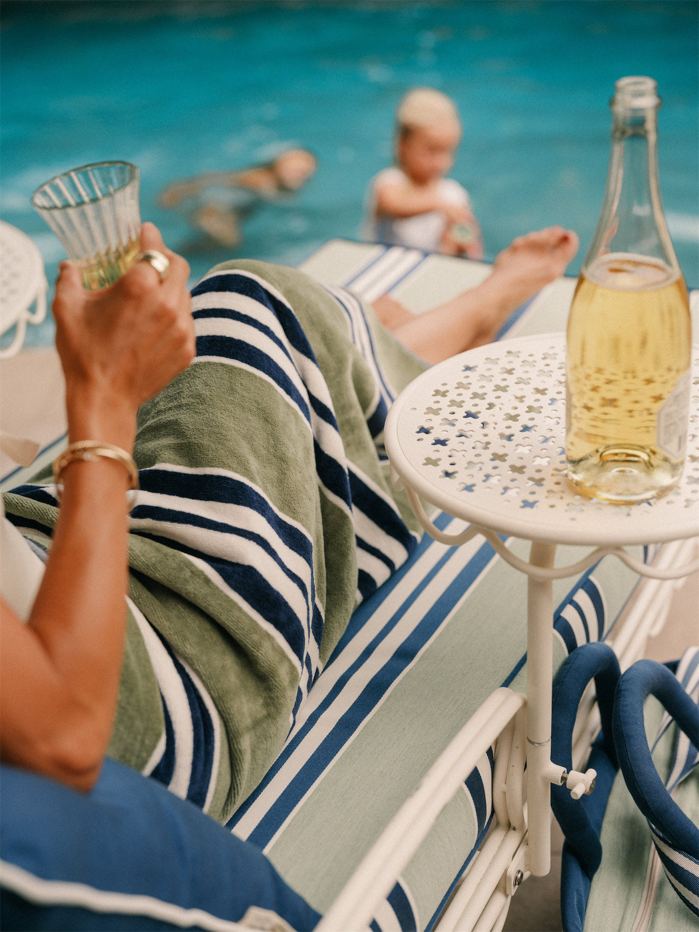 business and pleasure co blue green stripe pool towels outdoor cushions sun umbrellas coolers