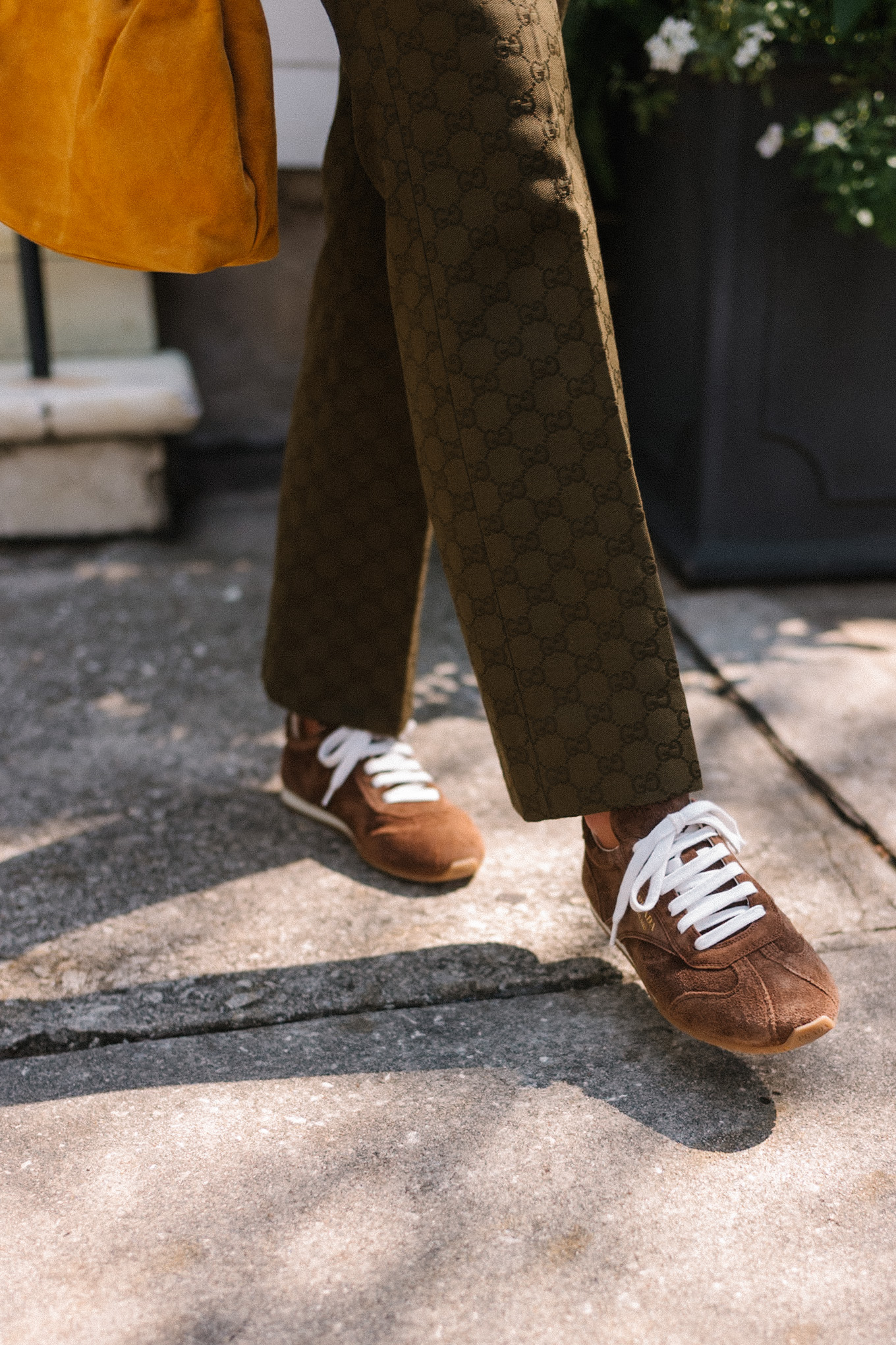 brown paisley jacket brown tank moss green pants brown suede sneakers gold suede bag