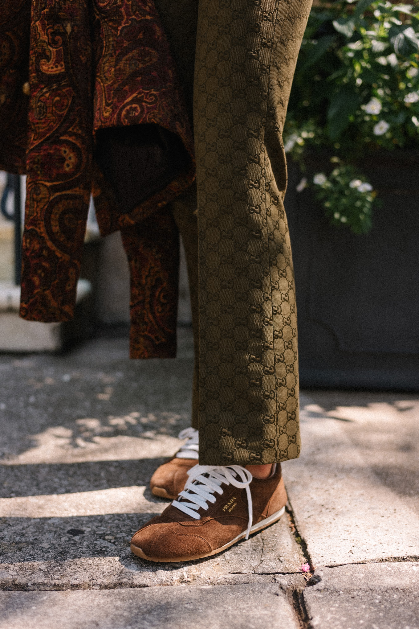 brown paisley jacket brown tank moss green pants brown suede sneakers gold suede bag