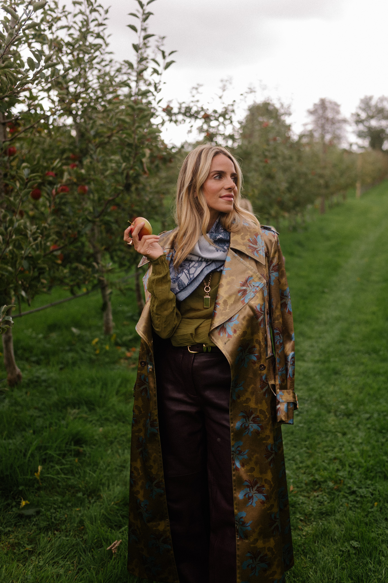 green sheer blouse maroon leather pants blue scarf jacquard trench