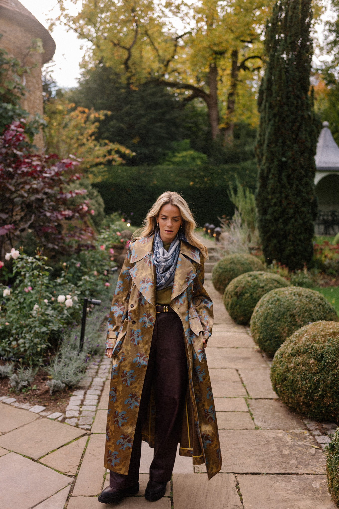 green sheer blouse maroon leather pants blue scarf jacquard trench