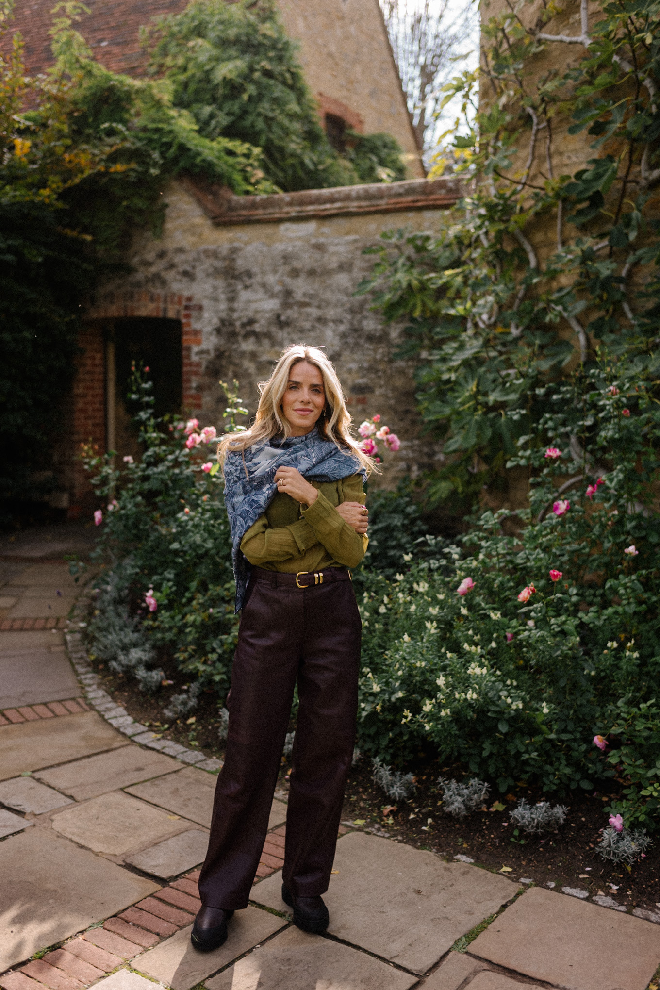 green sheer blouse maroon leather pants blue scarf jacquard trench