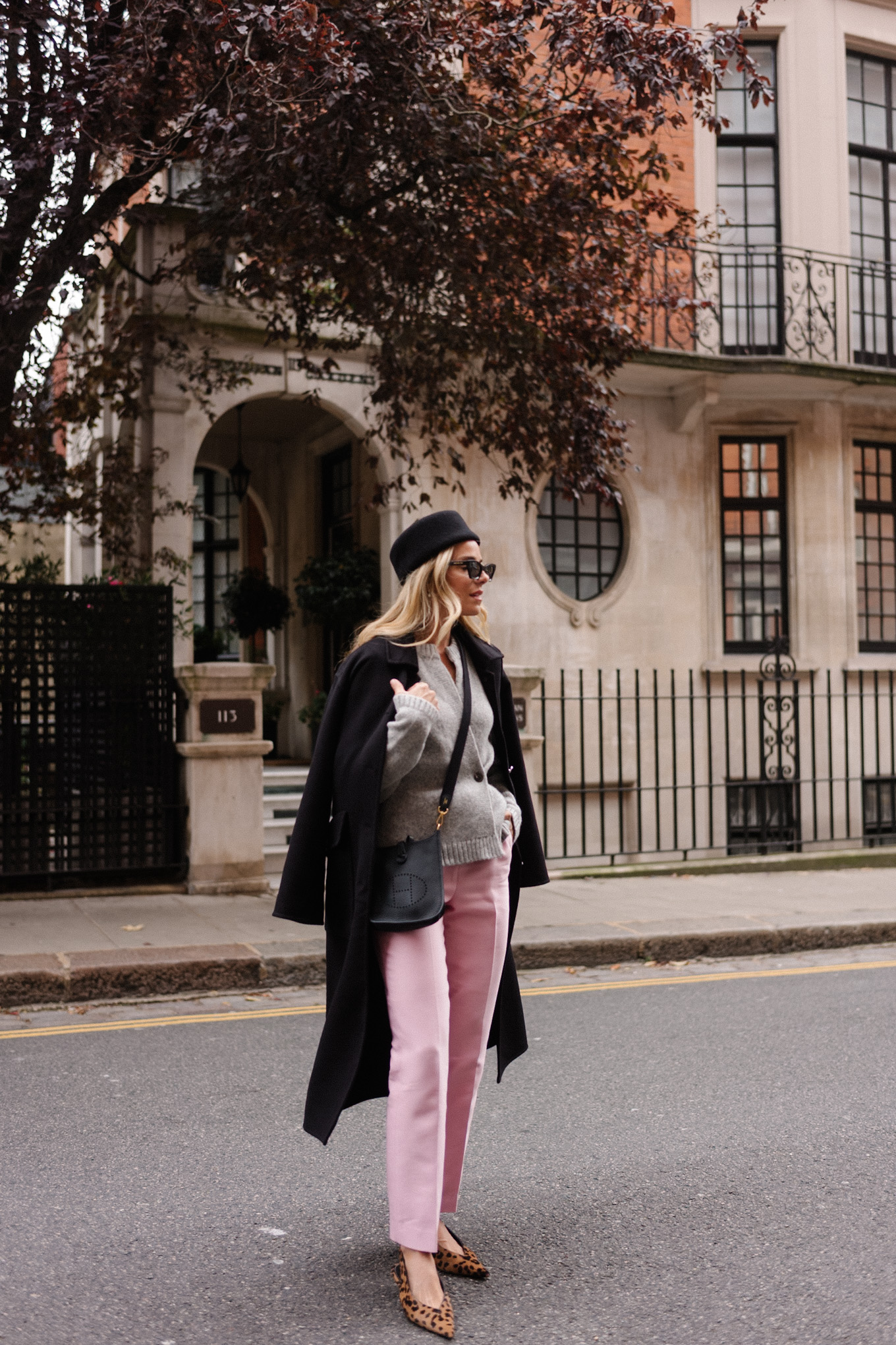 black wool coat grey cardigan pink satin pants black wool pillbox hat