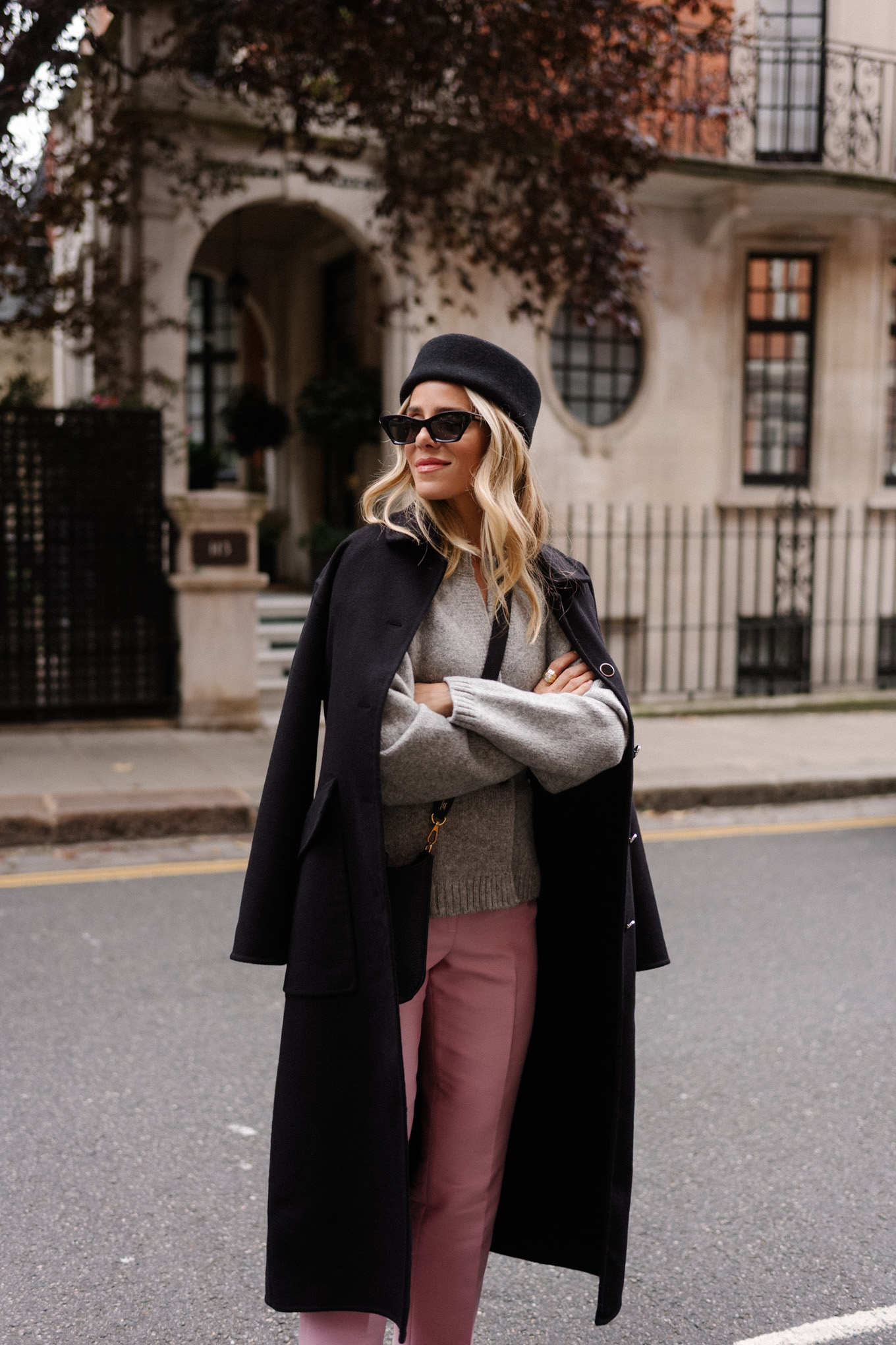 black wool coat grey cardigan pink satin pants black wool pillbox hat