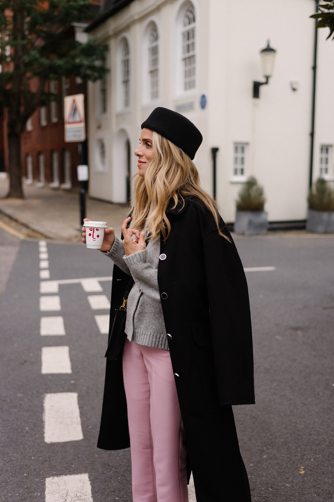 black wool coat grey cardigan pink satin pants black wool pillbox hat