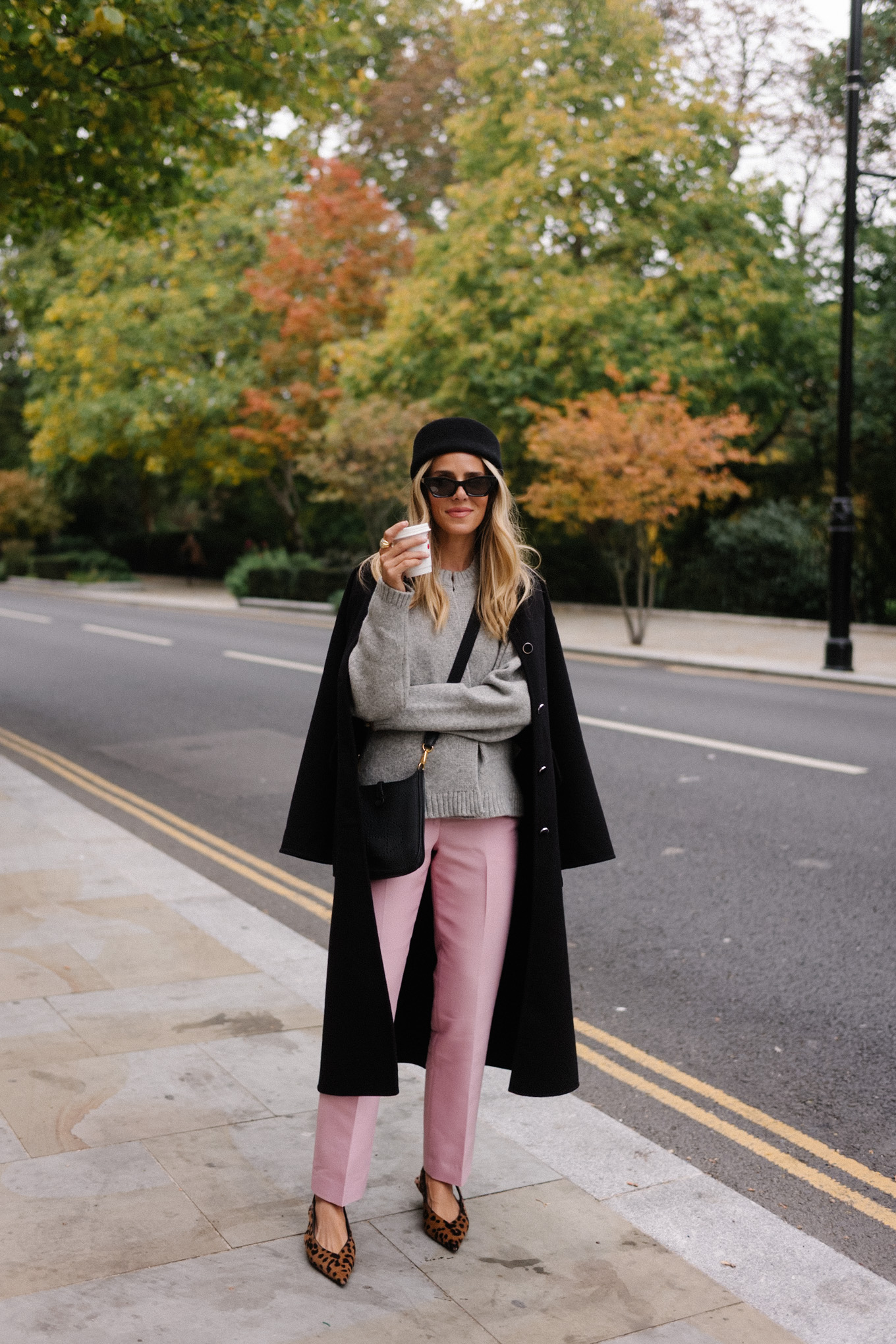 black wool coat grey cardigan pink satin pants black wool pillbox hat