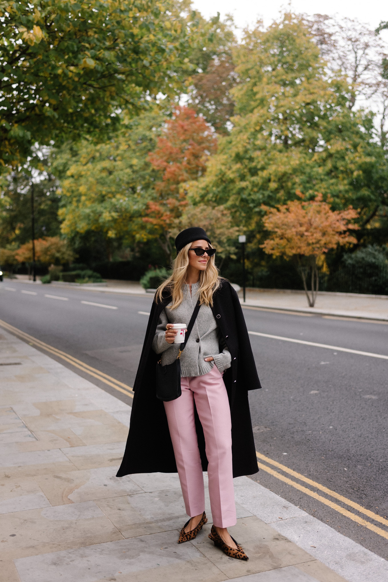 black wool coat grey cardigan pink satin pants black wool pillbox hat