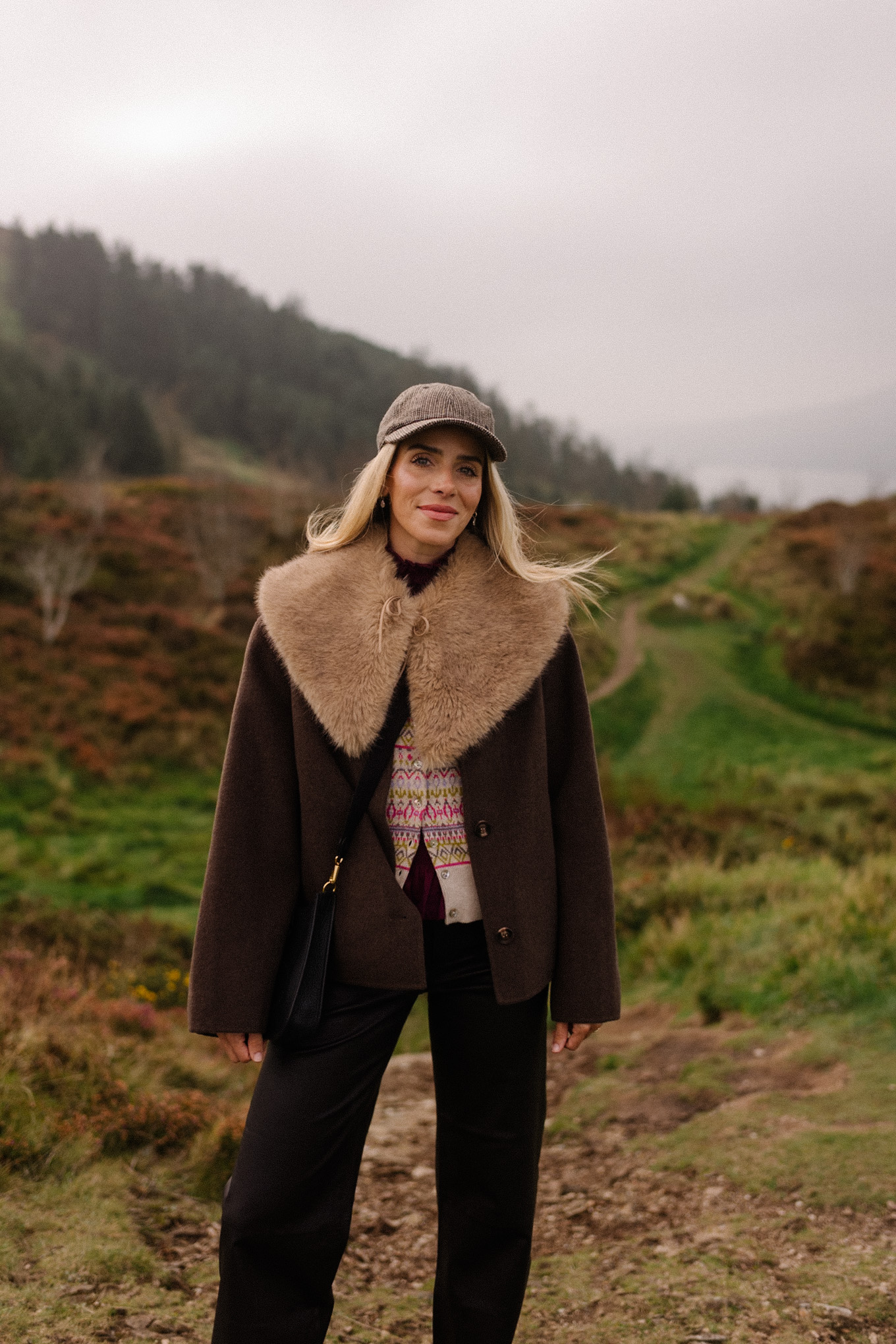 brown wool coat faux fur collar scarf black leather pants cashmere cardigan