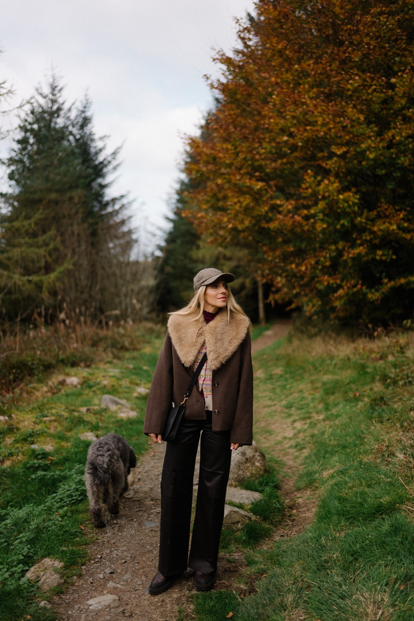 brown wool coat faux fur collar scarf black leather pants cashmere cardigan