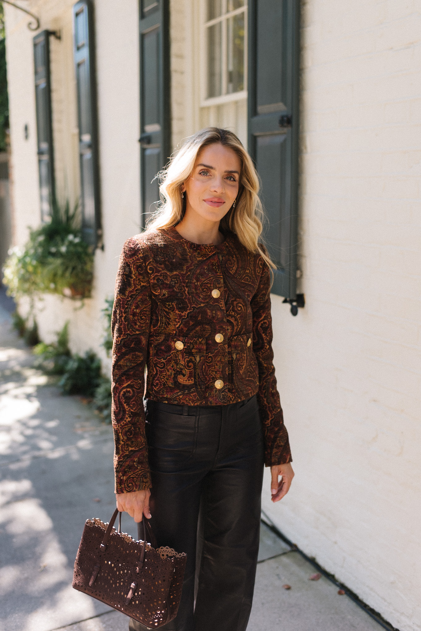 tailored jacket small suede bag suede mules leather pants