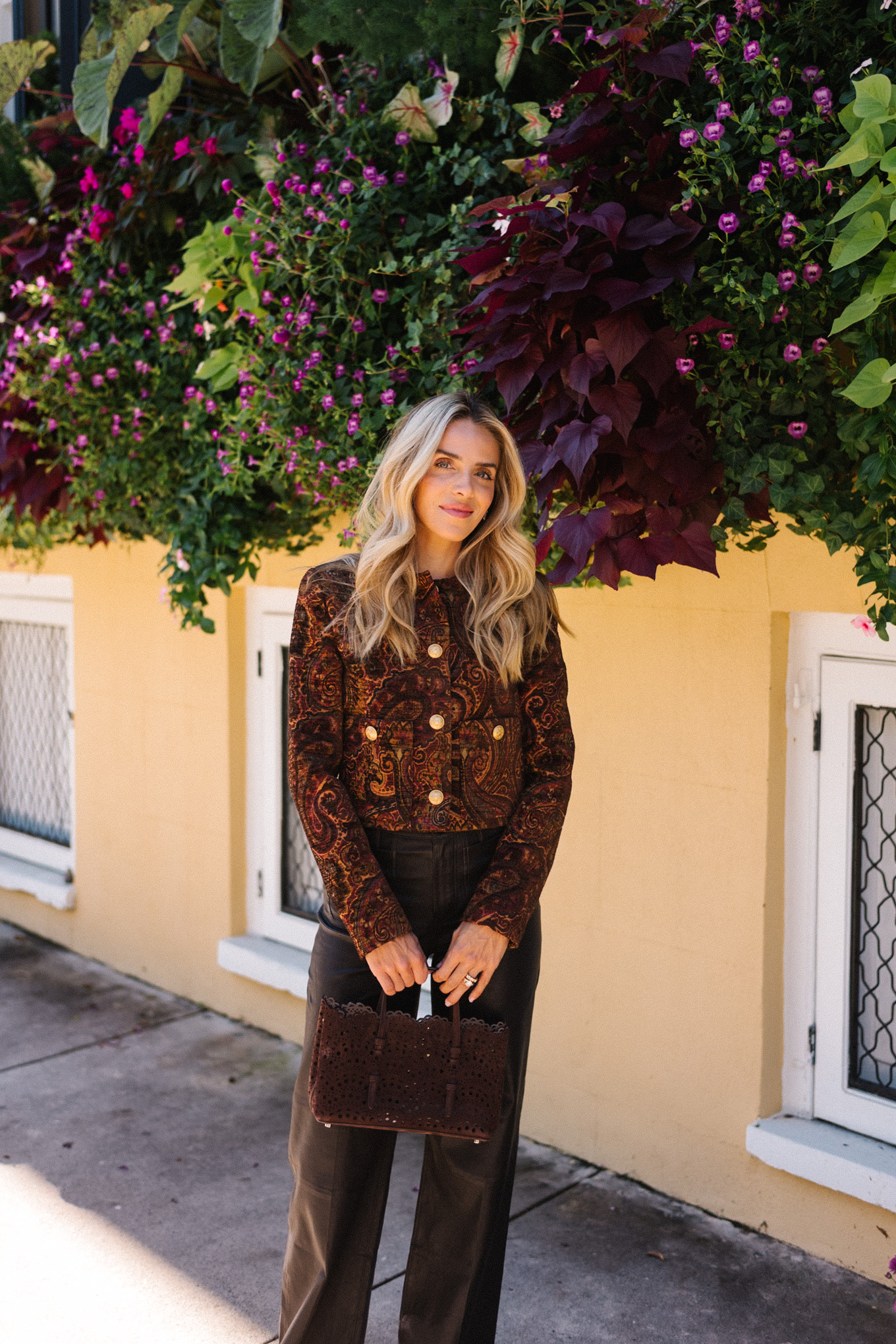 tailored jacket small suede bag suede mules leather pants