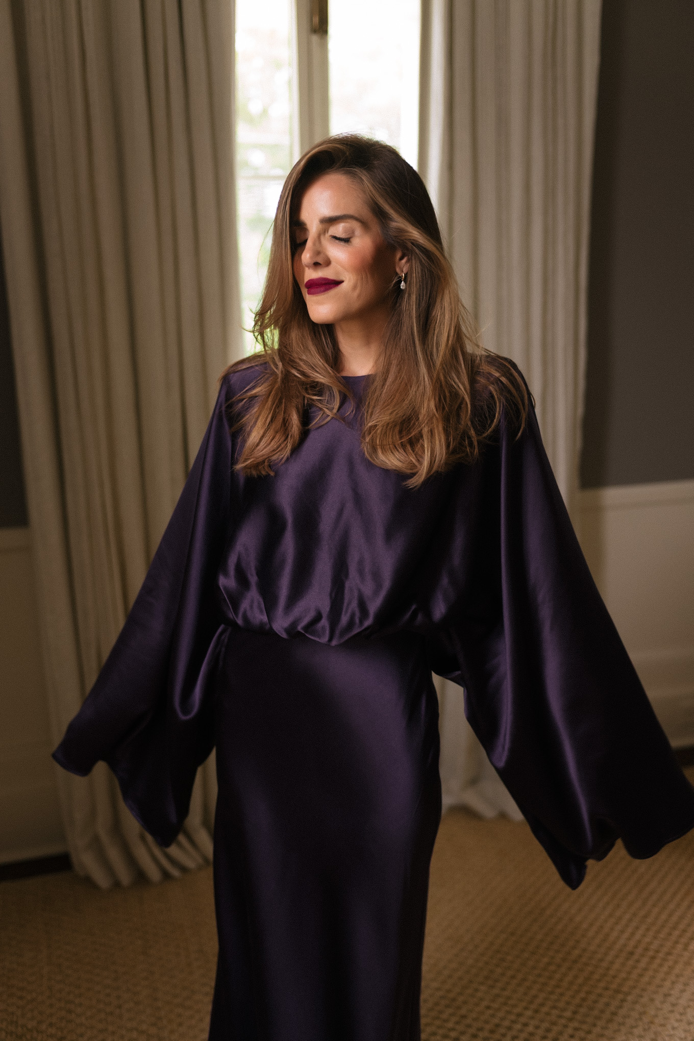 Beauty in purple silk dress on vacation