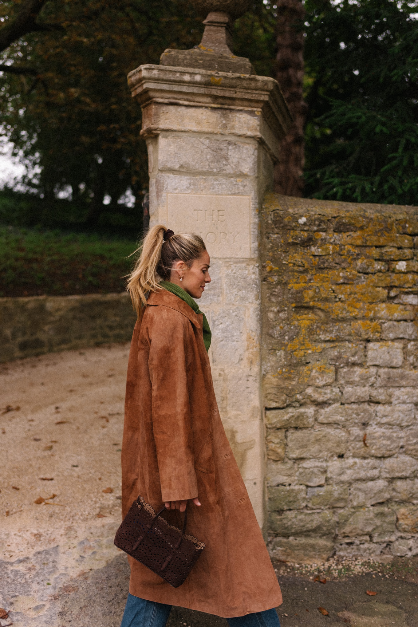 brown suede winter coat fair isle sweater vest green scarf blue denim brown boots