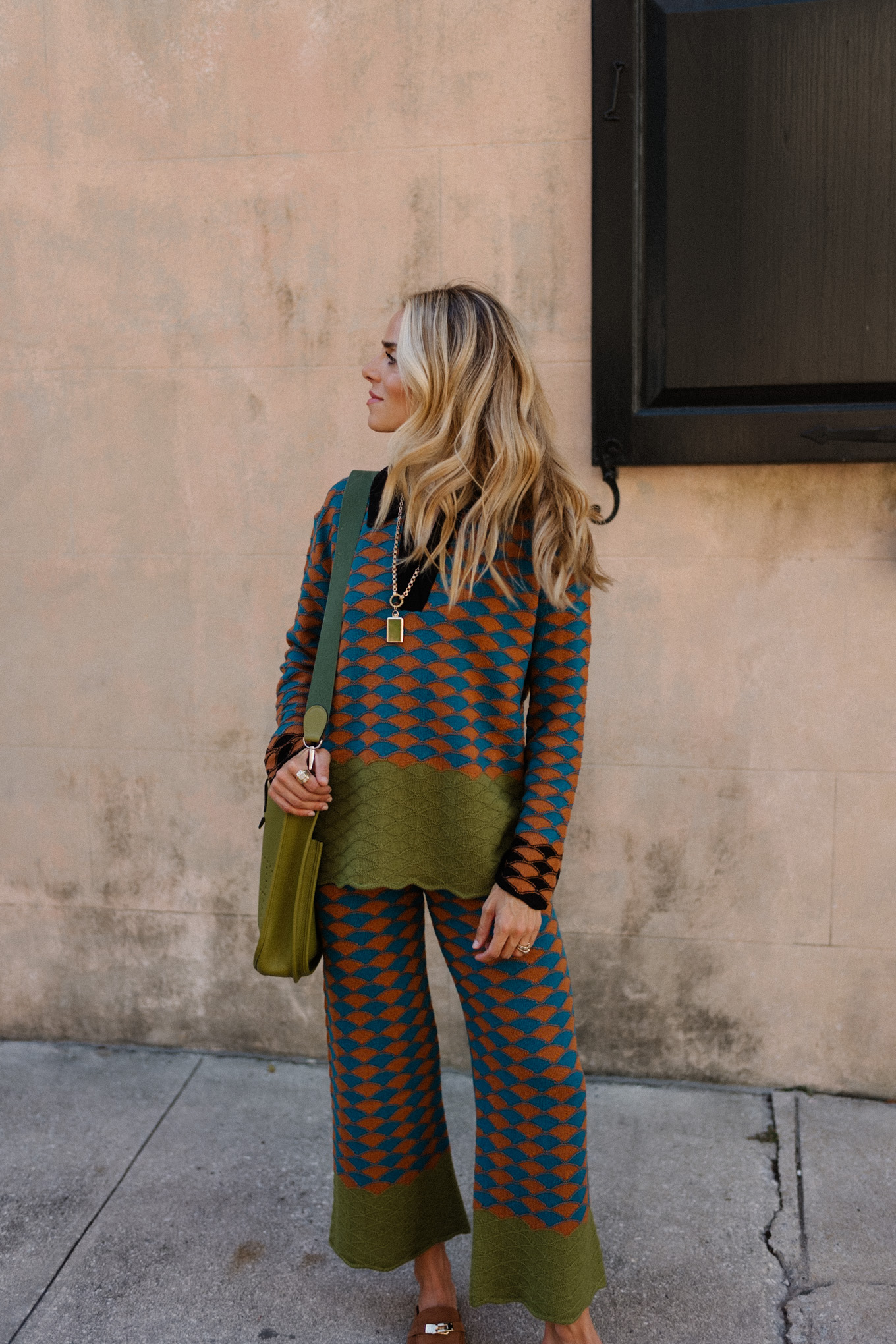 graphic sweater pants set green messenger bag brown suede mules