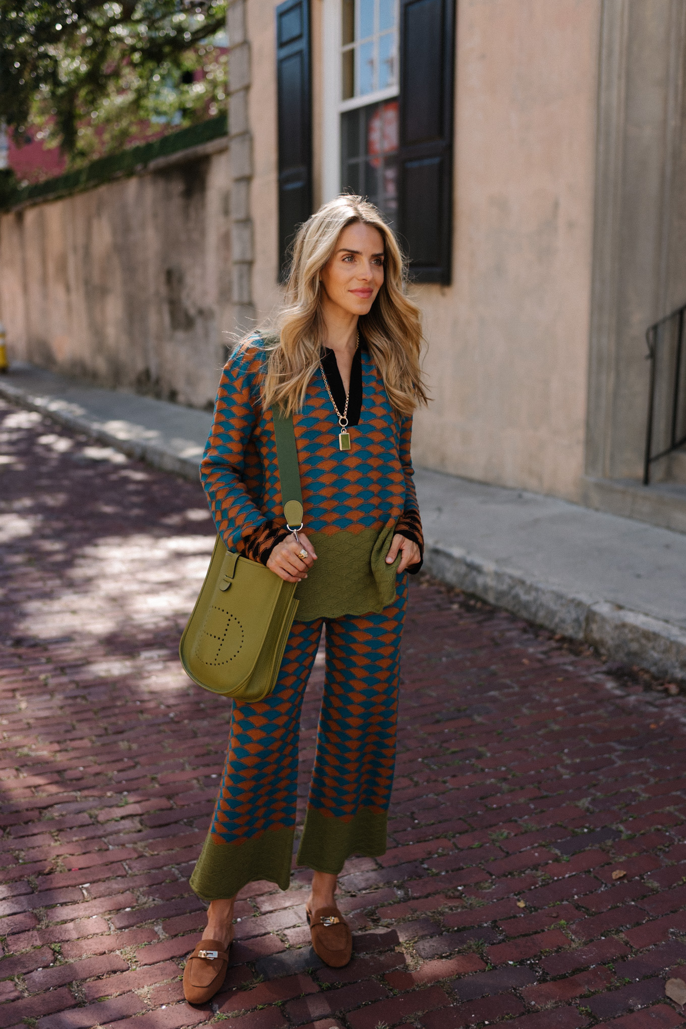 graphic sweater pants set green messenger bag brown suede mules