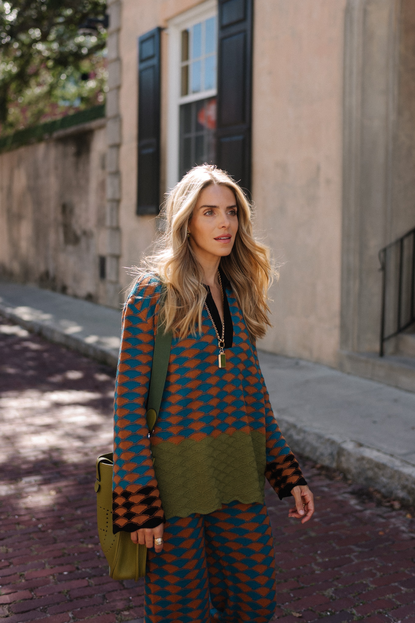 graphic sweater pants set green messenger bag brown suede mules